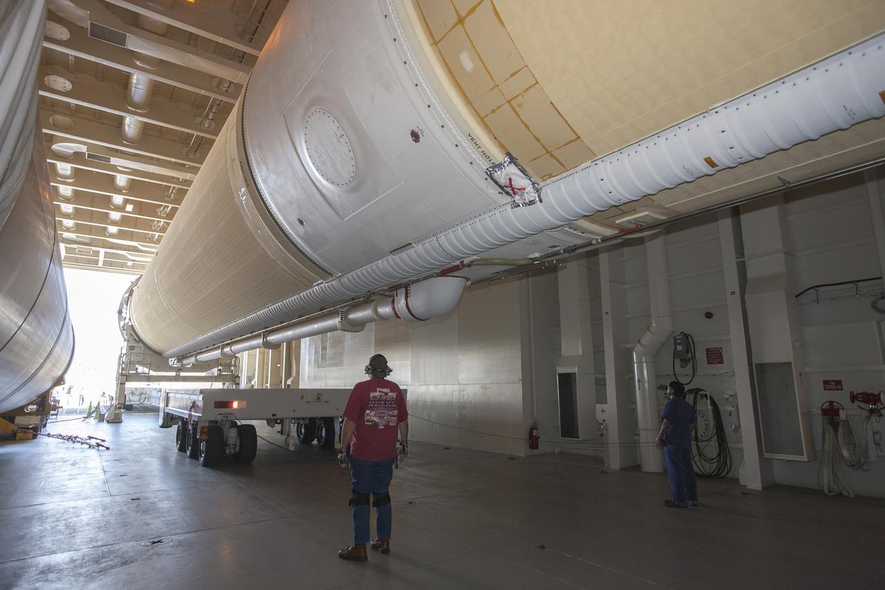 CAPE CANAVERAL, Fla. – Two of the three United Launch Alliance Delta IV heavy boosters for NASA’s upcoming Exploration Flight Test-1, or EFT-1, mission with the Orion spacecraft, have arrived by barge at the U.S. Army Outpost wharf at Port Canaveral in Florida. The core booster and starboard booster will be offloaded and then transported to the Horizontal Integration Facility, or HIF, at Space Launch Complex 37 on Cape Canaveral Air Force Station. The port booster and the upper stage are planned to be shipped to Cape Canaveral in April. At the HIF, all three boosters will be processed and checked out before being moved to the nearby launch pad and hoisted into position. During the EFT-1 mission, Orion will travel farther into space than any human spacecraft has gone in more than 40 years. The data gathered during the flight will influence design decisions, validate existing computer models and innovative new approaches to space systems development, as well as reduce overall mission risks and costs for later Orion flights. Liftoff of Orion on EFT-1 is planned for fall 2014. Photo credit: NASA/Kim Shiflett