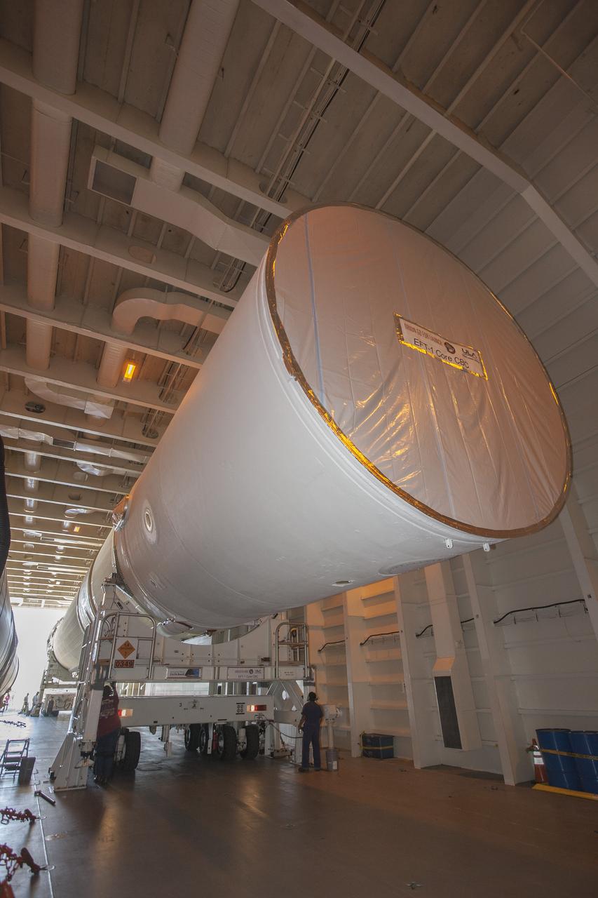 CAPE CANAVERAL, Fla. – Two of the three United Launch Alliance Delta IV heavy boosters for NASA’s upcoming Exploration Flight Test-1, or EFT-1, mission with the Orion spacecraft, have arrived by barge at the U.S. Army Outpost wharf at Port Canaveral in Florida. The core booster and starboard booster will be offloaded and then transported to the Horizontal Integration Facility, or HIF, at Space Launch Complex 37 on Cape Canaveral Air Force Station. The port booster and the upper stage are planned to be shipped to Cape Canaveral in April. At the HIF, all three boosters will be processed and checked out before being moved to the nearby launch pad and hoisted into position. During the EFT-1 mission, Orion will travel farther into space than any human spacecraft has gone in more than 40 years. The data gathered during the flight will influence design decisions, validate existing computer models and innovative new approaches to space systems development, as well as reduce overall mission risks and costs for later Orion flights. Liftoff of Orion on EFT-1 is planned for fall 2014. Photo credit: NASA/Kim Shiflett