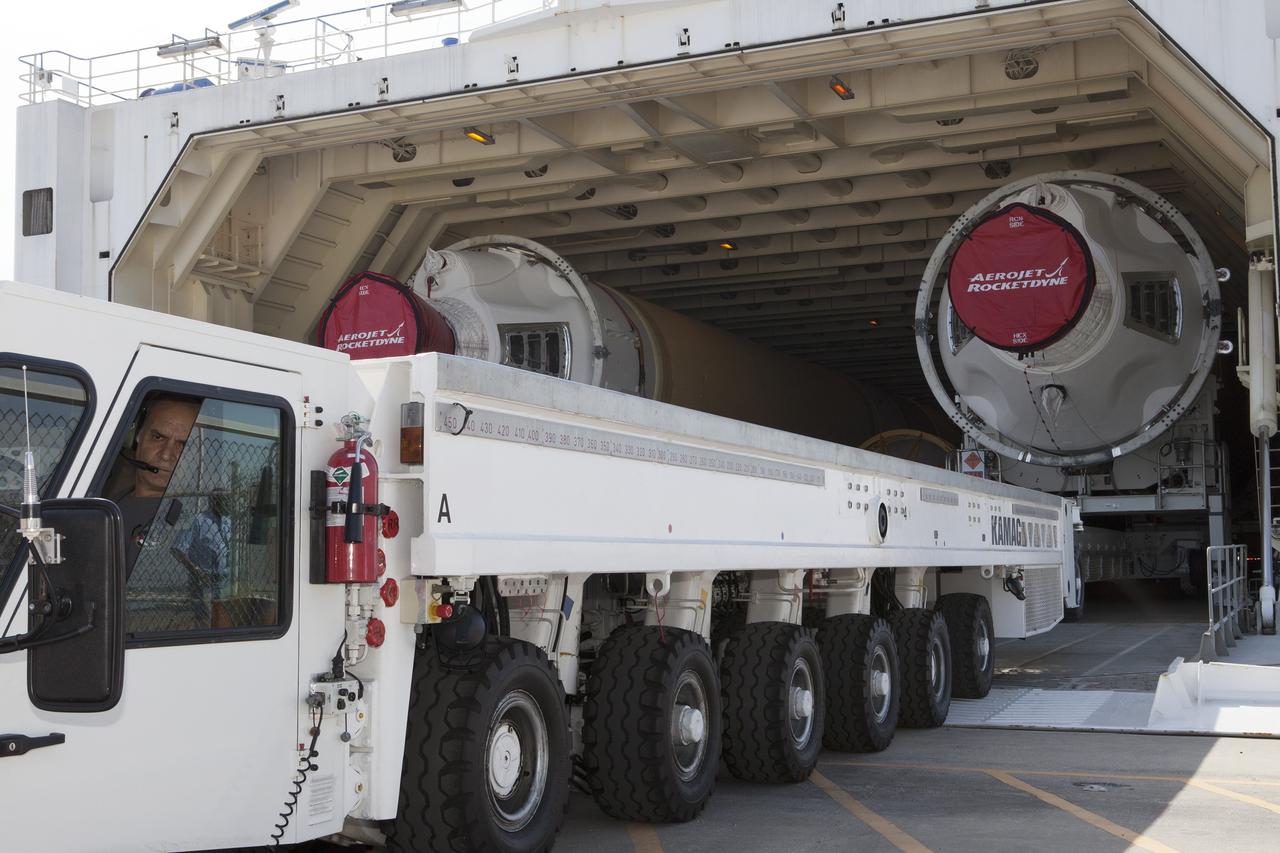 CAPE CANAVERAL, Fla. – Two of the three United Launch Alliance Delta IV heavy boosters for NASA’s upcoming Exploration Flight Test-1, or EFT-1, mission with the Orion spacecraft, have arrived by barge at the U.S. Army Outpost wharf at Port Canaveral in Florida. The core booster and starboard booster are being offloaded and will be transported to the Horizontal Integration Facility, or HIF, at Space Launch Complex 37 on Cape Canaveral Air Force Station. The port booster and the upper stage are planned to be shipped to Cape Canaveral in April.     At the HIF, all three boosters will be processed and checked out before being moved to the nearby launch pad and hoisted into position. During the EFT-1 mission, Orion will travel farther into space than any human spacecraft has gone in more than 40 years.  The data gathered during the flight will influence design decisions, validate existing computer models and innovative new approaches to space systems development, as well as reduce overall mission risks and costs for later Orion flights. Liftoff of Orion on EFT-1 is planned for fall 2014. Photo credit: NASA/Kim Shiflett