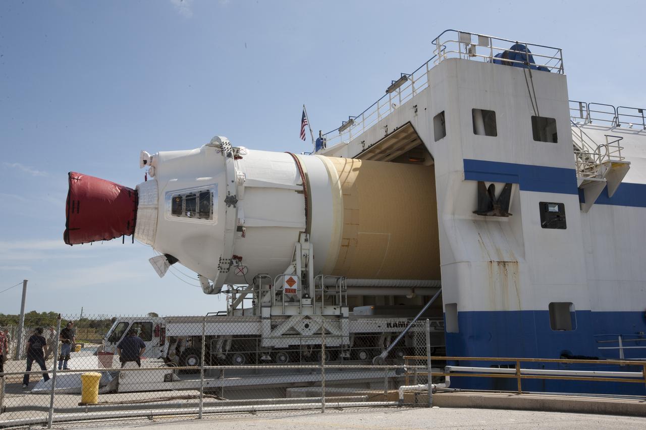 CAPE CANAVERAL, Fla. – Two of the three United Launch Alliance Delta IV heavy boosters for NASA’s upcoming Exploration Flight Test-1, or EFT-1, mission with the Orion spacecraft, have arrived by barge at the U.S. Army Outpost wharf at Port Canaveral in Florida. The core booster and starboard booster are being offloaded and will be transported to the Horizontal Integration Facility, or HIF, at Space Launch Complex 37 on Cape Canaveral Air Force Station. The port booster and the upper stage are planned to be shipped to Cape Canaveral in April. At the HIF, all three boosters will be processed and checked out before being moved to the nearby launch pad and hoisted into position. During the EFT-1 mission, Orion will travel farther into space than any human spacecraft has gone in more than 40 years. The data gathered during the flight will influence design decisions, validate existing computer models and innovative new approaches to space systems development, as well as reduce overall mission risks and costs for later Orion flights. Liftoff of Orion on EFT-1 is planned for fall 2014. Photo credit: NASA/Kim Shiflett