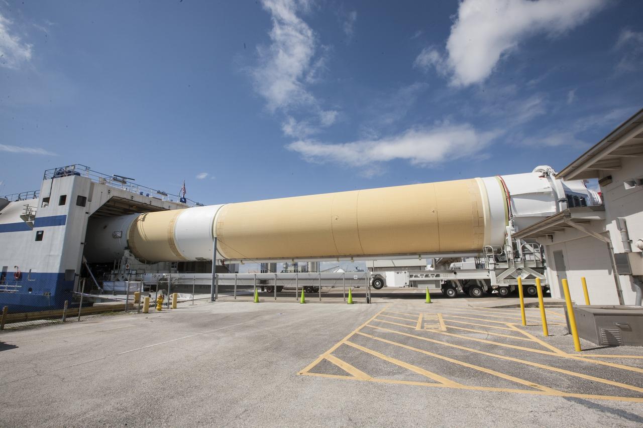 CAPE CANAVERAL, Fla. – Two of the three United Launch Alliance Delta IV heavy boosters for NASA’s upcoming Exploration Flight Test-1, or EFT-1, mission with the Orion spacecraft, have arrived by barge at the U.S. Army Outpost wharf at Port Canaveral in Florida. The core booster and starboard booster are being offloaded and will be transported to the Horizontal Integration Facility, or HIF, at Space Launch Complex 37 on Cape Canaveral Air Force Station. The port booster and the upper stage are planned to be shipped to Cape Canaveral in April. At the HIF, all three boosters will be processed and checked out before being moved to the nearby launch pad and hoisted into position. During the EFT-1 mission, Orion will travel farther into space than any human spacecraft has gone in more than 40 years. The data gathered during the flight will influence design decisions, validate existing computer models and innovative new approaches to space systems development, as well as reduce overall mission risks and costs for later Orion flights. Liftoff of Orion on EFT-1 is planned for fall 2014. Photo credit: NASA/Kim Shiflett