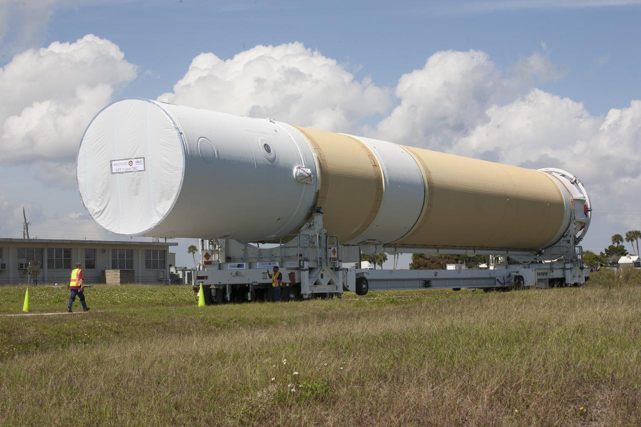 CAPE CANAVERAL, Fla. – Two of the three United Launch Alliance Delta IV heavy boosters for NASA’s upcoming Exploration Flight Test-1, or EFT-1, mission with the Orion spacecraft, arrived by barge at the U.S. Army Outpost wharf at Port Canaveral in Florida. The core booster, shown in this photo, and starboard booster were offloaded and will be transported to the Horizontal Integration Facility, or HIF, at Space Launch Complex 37 on Cape Canaveral Air Force Station. The port booster and the upper stage are planned to be shipped to Cape Canaveral in April. At the HIF, all three boosters will be processed and checked out before being moved to the nearby launch pad and hoisted into position. During the EFT-1 mission, Orion will travel farther into space than any human spacecraft has gone in more than 40 years. The data gathered during the flight will influence design decisions, validate existing computer models and innovative new approaches to space systems development, as well as reduce overall mission risks and costs for later Orion flights. Liftoff of Orion on EFT-1 is planned for fall 2014. Photo credit: NASA/Kim Shiflett