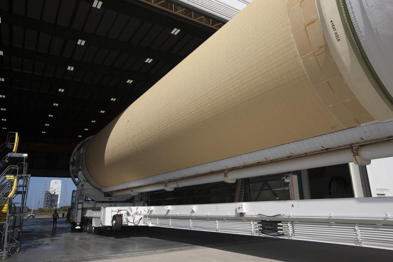 CAPE CANAVERAL, Fla. – The core booster for the United Launch Alliance Delta IV heavy for NASA’s upcoming Exploration Flight Test-1, or EFT-1, mission with the Orion spacecraft, was transported to the Horizontal Integration Facility, or HIF, at Space Launch Complex 37 on Cape Canaveral Air Force Station in Florida. The core booster and starboard booster arrived by barge at the U.S. Army Outpost wharf at Port Canaveral. The port booster and the upper stage are planned to be shipped to Cape Canaveral in April. At the HIF, all three boosters will be processed and checked out before being moved to the nearby launch pad and hoisted into position. During the EFT-1 mission, Orion will travel farther into space than any human spacecraft has gone in more than 40 years. The data gathered during the flight will influence design decisions, validate existing computer models and innovative new approaches to space systems development, as well as reduce overall mission risks and costs for later Orion flights. Liftoff of Orion on EFT-1 is planned for fall 2014. Photo credit: NASA/Kim Shiflett