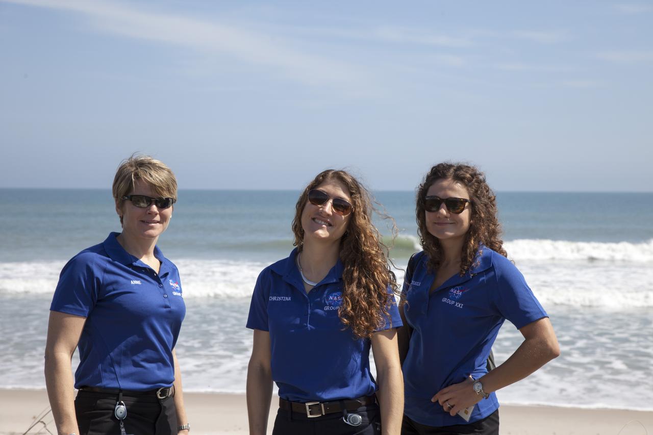 CAPE CANAVERAL, Fla. - NASA astronaut candidates, from left, Anne McClain, Christina Hammock and Jessica Meir stand on the beach overlooking the Atlantic Ocean at the Beach House at NASA's Kennedy Space Center. The Beach House is a traditional gathering place for astronauts before they fly into space. The astronaut class of 2013 was selected by NASA after an extensive year-and-a-half search. The new group will help the agency push the boundaries of exploration and travel to new destinations in the solar system. To learn more about the astronaut class of 2013, visit: http://www.nasa.gov/astronauts/2013astroclass.html Photo credit: NASA/Daniel Casper