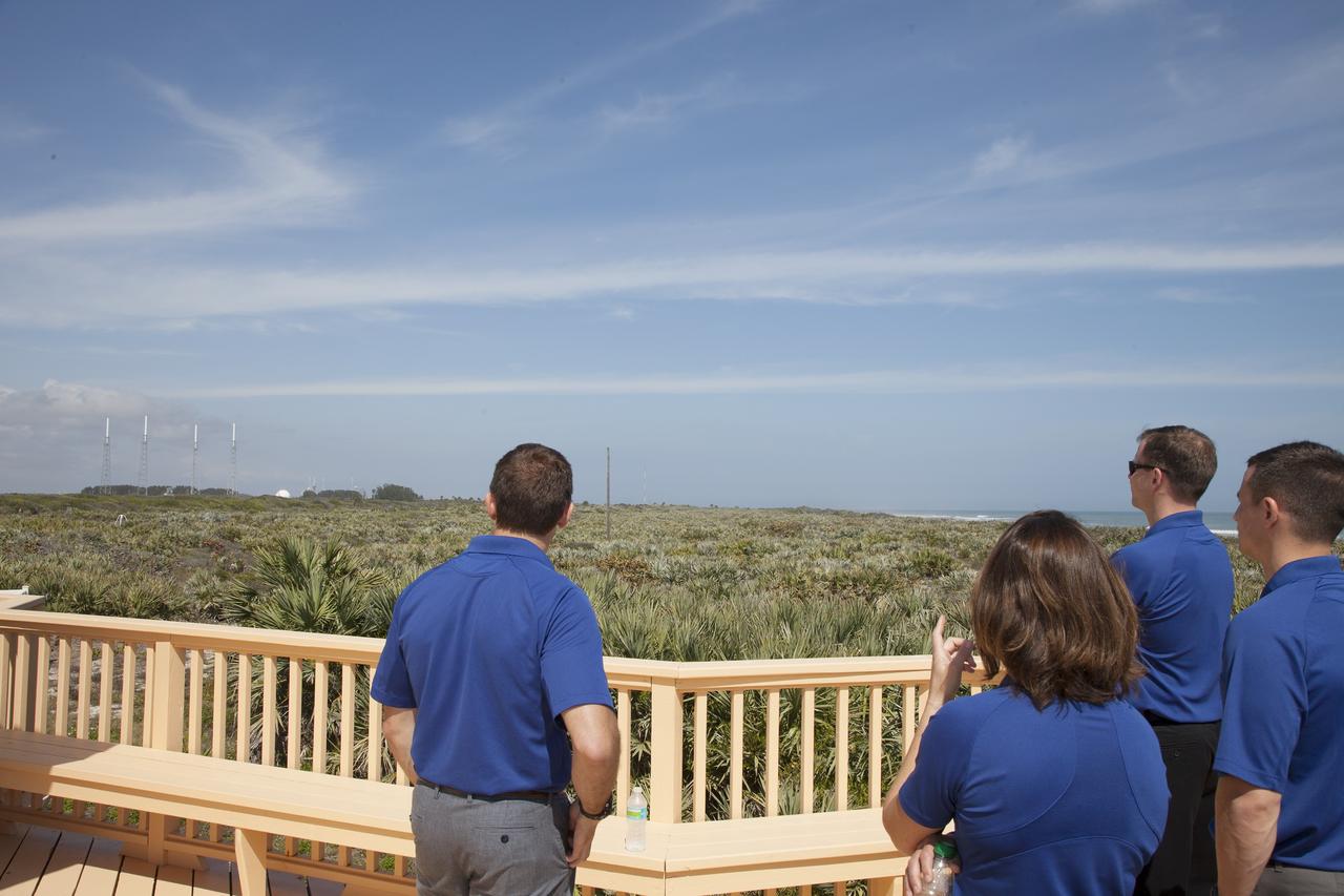 CAPE CANAVERAL, Fla. - NASA astronaut candidates, from left, Josh Cassada, Nicole Mann, Tyler "Nick" Hague and Andrew Morgan look out on Kennedy Space Center at the Beach House. The Beach House is a traditional gathering place for astronauts before they fly into space. The astronaut class of 2013 was selected by NASA after an extensive year-and-a-half search. The new group will help the agency push the boundaries of exploration and travel to new destinations in the solar system. To learn more about the astronaut class of 2013, visit: http://www.nasa.gov/astronauts/2013astroclass.html Photo credit: NASA/Daniel Casper