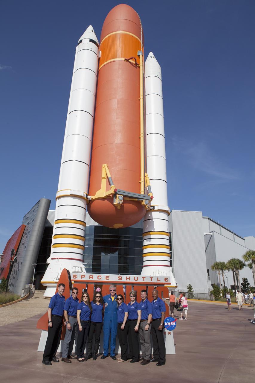 CAPE CANAVERAL, Fla. – Astronaut candidates Tyler "Nick" Hague, Josh Cassada, Christina Hamock, Jessica Meir, STS-41G astronaut Jon McBride, astronaut candidates Nicole Mann, Anne McClain, Andrew Morgan and Victor Glover pose in front of the Space Shuttle Atlantis exhibit and its full-scale external tank and solid rocket booster stack at the Kennedy Space Center Visitor Complex in Florida. The astronaut class of 2013 was selected by NASA after an extensive year-and-a-half search. The new group will help the agency push the boundaries of exploration and travel to new destinations in the solar system. To learn more about the astronaut class of 2013, visit: http://www.nasa.gov/astronauts/2013astroclass.html Photo credit: NASA/Daniel Casper