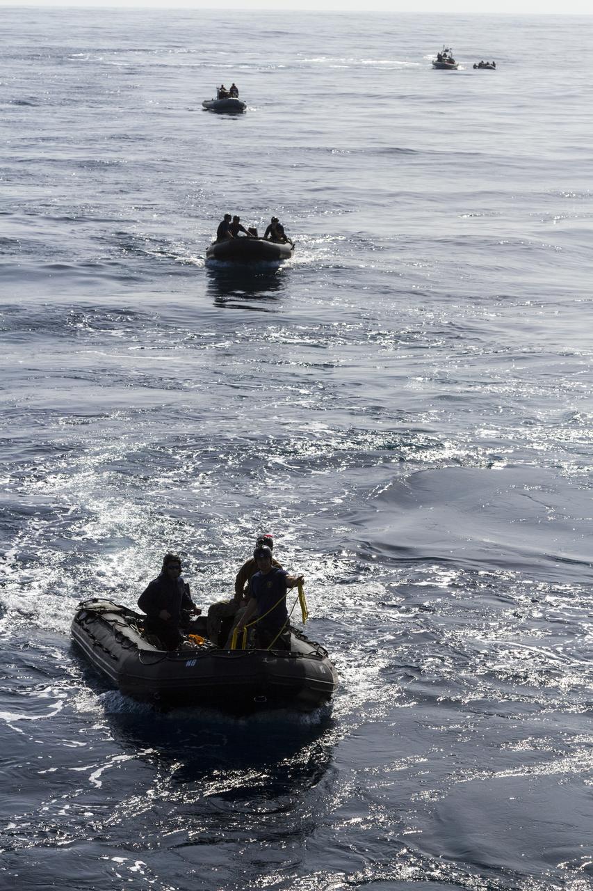 SAN DIEGO, Calif. – U.S. Navy personnel use several rigid hull inflatable boats during the Orion underway recovery test. Earlier in the week, the Orion boilerplate test vehicle and other hardware were transported in the well deck of the USS San Diego about 100 miles offshore for an underway recovery test. NASA and the U.S. Navy conducted tests to prepare for recovery of the Orion crew module, forward bay cover and parachutes on its return from a deep space mission. The underway recovery test allowed the teams to demonstrate and evaluate the recovery processes, procedures, hardware and personnel in open waters. During the testing, the tether lines were unable to support the tension caused by crew module motion that was driven by wave turbulence in the well deck of the ship. NASA and the U.S. Navy are reviewing the testing data collected to evaluate the next steps. The Ground Systems Development and Operations Program conducted the underway recovery tests. Orion is the exploration spacecraft designed to carry astronauts to destinations not yet explored by humans, including an asteroid and Mars. It will have emergency abort capability, sustain the crew during space travel and provide safe re-entry from deep space return velocities. The first unpiloted test flight of the Orion is scheduled to launch in 2014 atop a Delta IV rocket and in 2017 on NASA’s Space Launch System rocket. For more information, visit http://www.nasa.gov/orion. Photo credit: NASA/Cory Huston