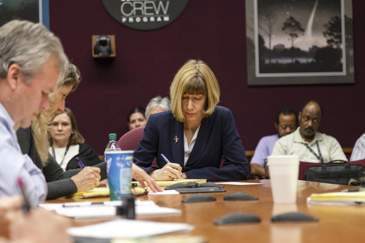 CAPE CANAVERAL, Fla. - Kathy Lueders, manager of NASA's Commercial Crew Program, listens to updates during a meeting with the staff at NASA's Kennedy Space Center in Florida. Photo credit: NASA/Frankie Martin
