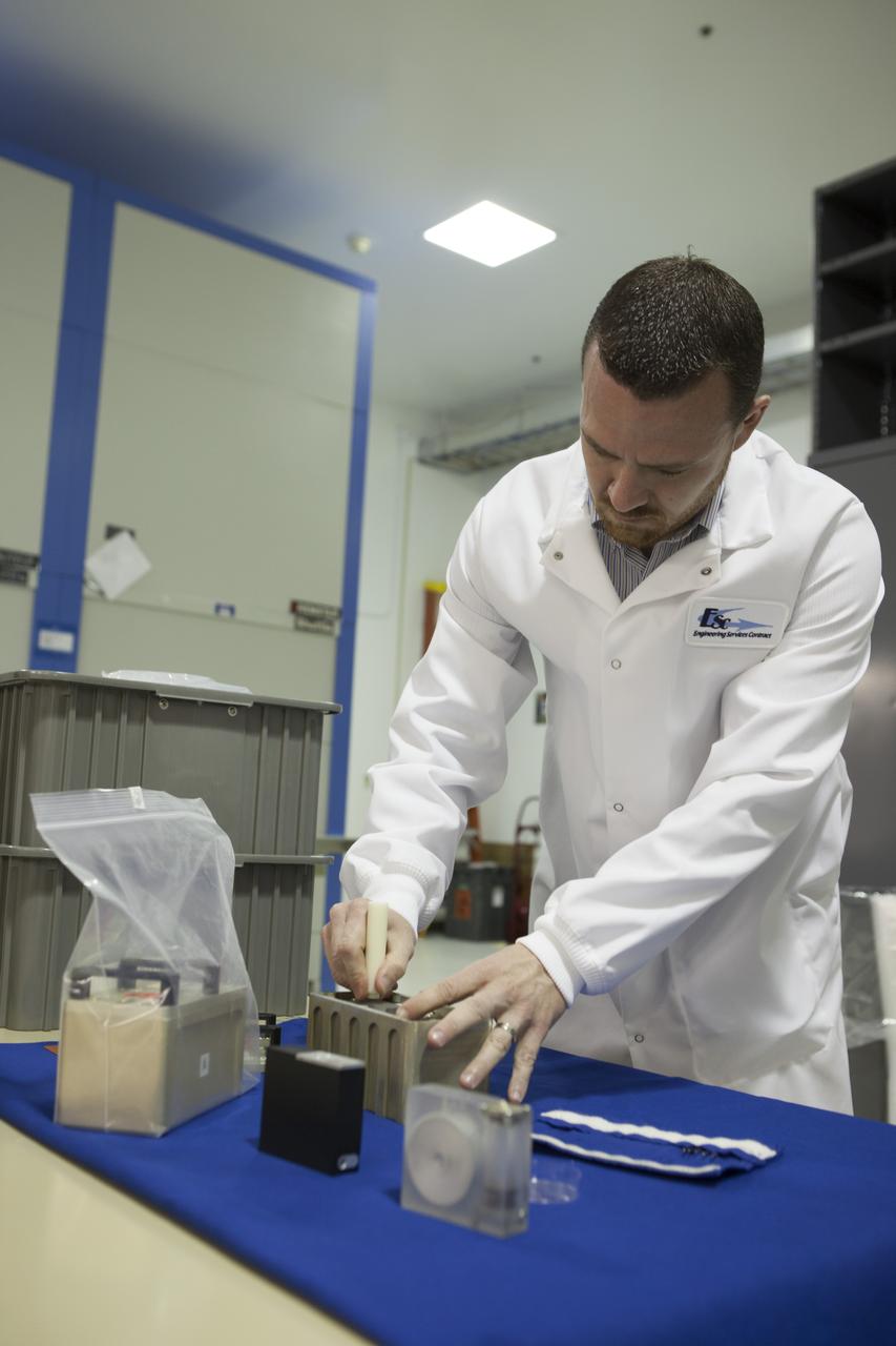 CAPE CANAVERAL, Fla. - In the Space Station Processing Facility at NASA's Kennedy Space Center in Florida, Terry Tullis, a QinetiQ North America mechanical engineer, prepares the Biological Research In Canisters, or BRIC, 18-1 and 18-2 experiments which will be launched to the International Space Station aboard a SpaceX Dragon spacecraft. Scheduled for launch on March 16 atop a Falcon 9 rocket, Dragon will be marking its fourth trip to the space station. The SpaceX-3 mission is the third of 12 flights contracted by NASA to resupply the orbiting laboratory. For more information, visit http://www.nasa.gov/mission_pages/station/structure/launch/index.html Photo credit: NASA/Kim Shiflett