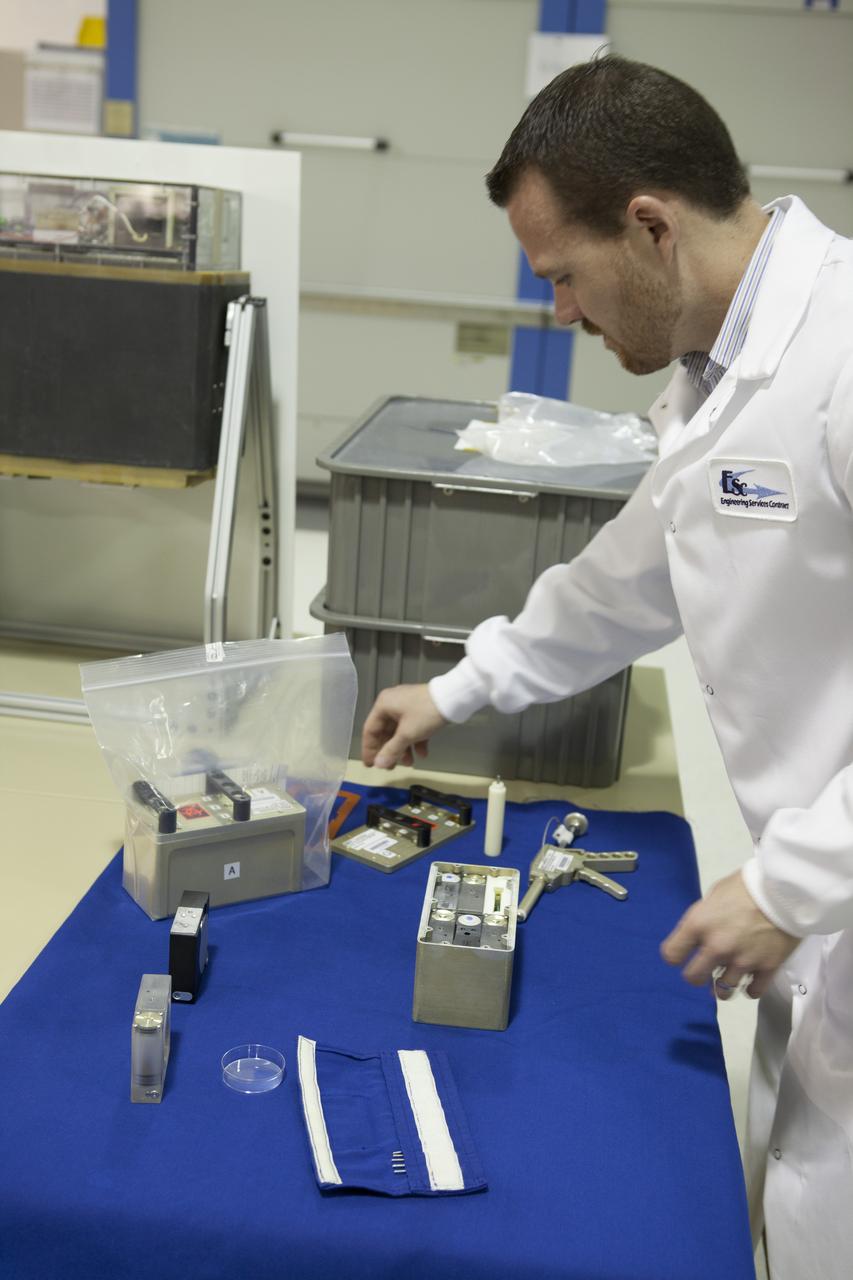 CAPE CANAVERAL, Fla. - In the Space Station Processing Facility at NASA's Kennedy Space Center in Florida, Terry Tullis, a QinetiQ North America mechanical engineer, prepares the Biological Research In Canisters, or BRIC, 18-1 and 18-2 experiments which will be launched to the International Space Station aboard a SpaceX Dragon spacecraft. Scheduled for launch on March 16 atop a Falcon 9 rocket, Dragon will be marking its fourth trip to the space station. The SpaceX-3 mission is the third of 12 flights contracted by NASA to resupply the orbiting laboratory. For more information, visit http://www.nasa.gov/mission_pages/station/structure/launch/index.html Photo credit: NASA/Kim Shiflett