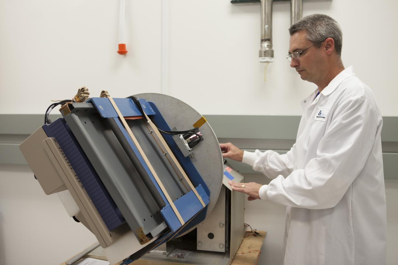 CAPE CANAVERAL, Fla. - In the Space Station Processing Facility at NASA's Kennedy Space Center in Florida, Donald Houzer, a QinetiQ North America mechanical technician checks out the Advanced Plant Experiment, or APEX, experiment as it is being prepared for launch to the International Space Station aboard a SpaceX Dragon spacecraft. Scheduled for launch on March 16 atop a Falcon 9 rocket, Dragon will be marking its fourth trip to the space station. The SpaceX-3 mission is the third of 12 flights contracted by NASA to resupply the orbiting laboratory. For more information, visit http://www.nasa.gov/mission_pages/station/structure/launch/index.html Photo credit: NASA/Kim Shiflett