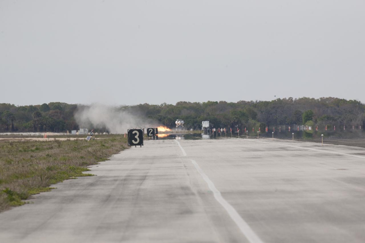 CAPE CANAVERAL, Fla. - The Project Morpheus prototype lander lifts off in the automated landing and hazard avoidance technology, or ALHAT, hazard field for its seventh free flight test at the north end of the Shuttle Landing Facility at NASA’s Kennedy Space Center in Florida. The 83-second test began at 3:41 p.m. EDT with the Morpheus lander launching from the ground over a flame trench and ascending to 580 feet, its highest to date. Morpheus then flew its fastest downrange trek at 30 mph, travelling farther than before, 837 feet. The lander performed a 42-foot divert to emulate a hazard avoidance maneuver before descending and touching down on Landing Site 2, at the northern landing pad inside the hazard field. Morpheus landed within one foot of its intended target. Project Morpheus tests NASA’s ALHAT and an engine that runs on liquid oxygen and methane, or green propellants, into a fully-operational lander that could deliver cargo to other planetary surfaces. The landing facility provides the lander with the kind of field necessary for realistic testing, complete with rocks, craters and hazards to avoid. Morpheus’ ALHAT payload allows it to navigate to clear landing sites amidst rocks, craters and other hazards during its descent. Project Morpheus is being managed under the Advanced Exploration Systems, or AES, Division in NASA’s Human Exploration and Operations Mission Directorate. The efforts in AES pioneer new approaches for rapidly developing prototype systems, demonstrating key capabilities and validating operational concepts for future human missions beyond Earth orbit. For more information on Project Morpheus, visit http://morpheuslander.jsc.nasa.gov/. Photo credit: NASA/Kim Shiflett