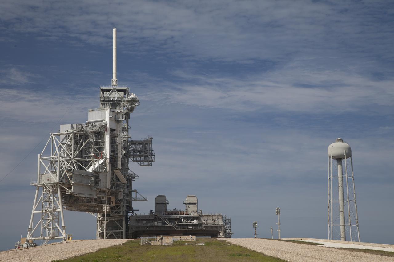 CAPE CANAVERAL, Fla. -- Launch pad 39A looks much like it did after the liftoff of STS-135, the final space shuttle mission, on July 8, 2011. The mobile launcher platform remains in place next to the fixed service structure and rotating service structure. Located at NASA's Kennedy Space Center in Florida, pad 39A was originally built for the Apollo/Saturn V rockets that launched American astronauts on their historic journeys to the moon and later modified to support the 30-year shuttle program. Both launch pad 39A and 39B pad 39A was originally built for the Apollo/Saturn V rockets that launched American astronauts on their historic journeys to the moon and later modified to support the 30-year shuttle program. To learn more about Launch Pad 39A visit: http://www.nasa.gov/mission_pages/shuttle/launch/launch-complex39-toc.html Photo credit: NASA/Dan Casper