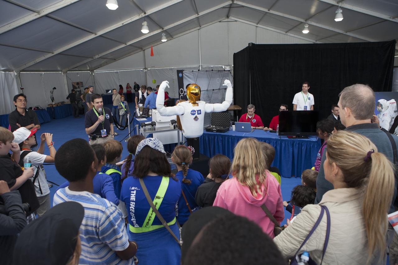 CAPE CANAVERAL, Fla. – A torso model of Robonaut 2, identical to R2 already on the International Space Station, is introduced to a crowd of onlookers by Ron Diftler of NASA's Johnson Space Center in Houston. The demonstration was one of several provided during the Robot Rocket Rally. The three-day event at Florida's Kennedy Space Center Visitor Complex is highlighted by exhibits, games and demonstrations of a variety of robots, with exhibitors ranging from school robotics clubs to veteran NASA scientists and engineers. Photo credit: NASA/Kim Shiflett