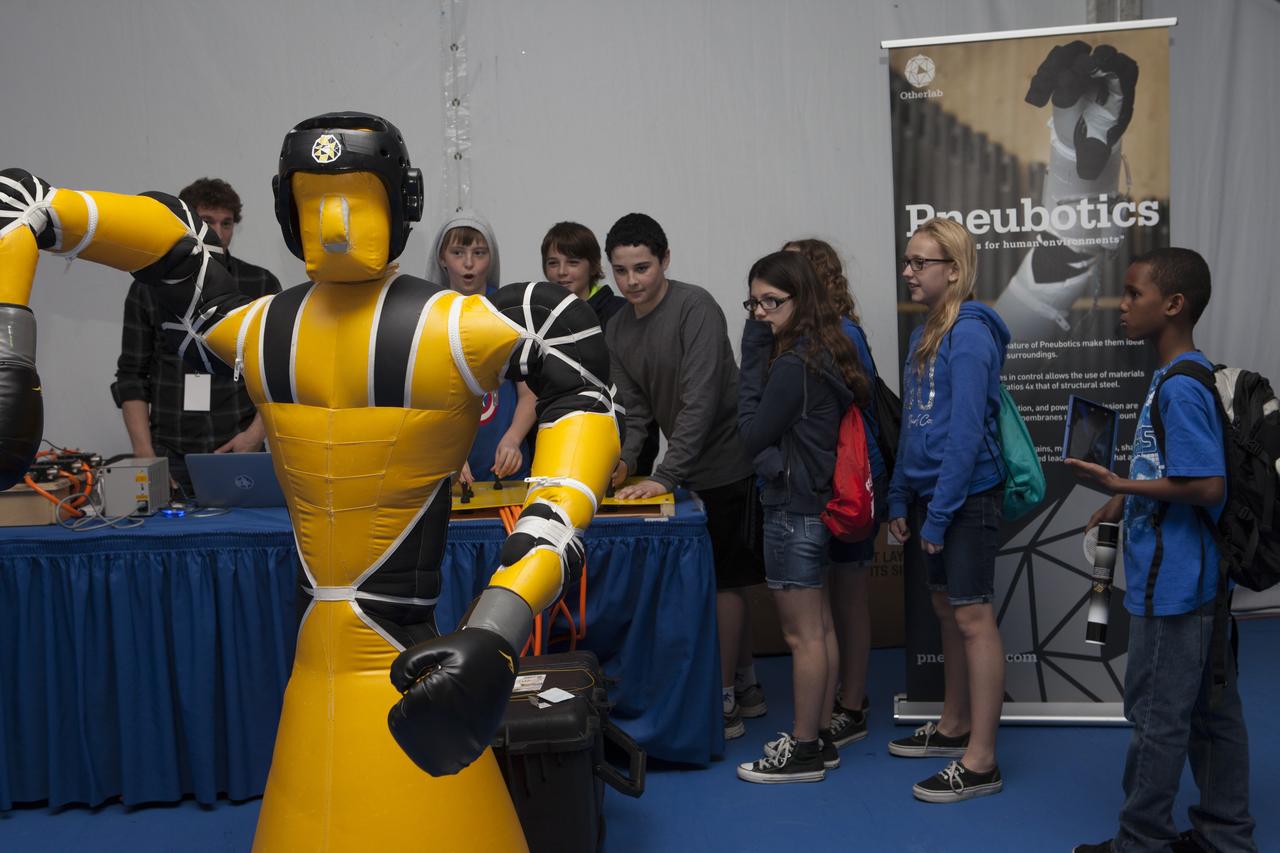 CAPE CANAVERAL, Fla. – Students observe as Otherlab shows off a life-size, inflatable robot from its "" program. The demonstration was one of several provided during the Robot Rocket Rally. The three-day event at Florida's Kennedy Space Center Visitor Complex is highlighted by exhibits, games and demonstrations of a variety of robots, with exhibitors ranging from school robotics clubs to veteran NASA scientists and engineers. Photo credit: NASA/Kim Shiflett