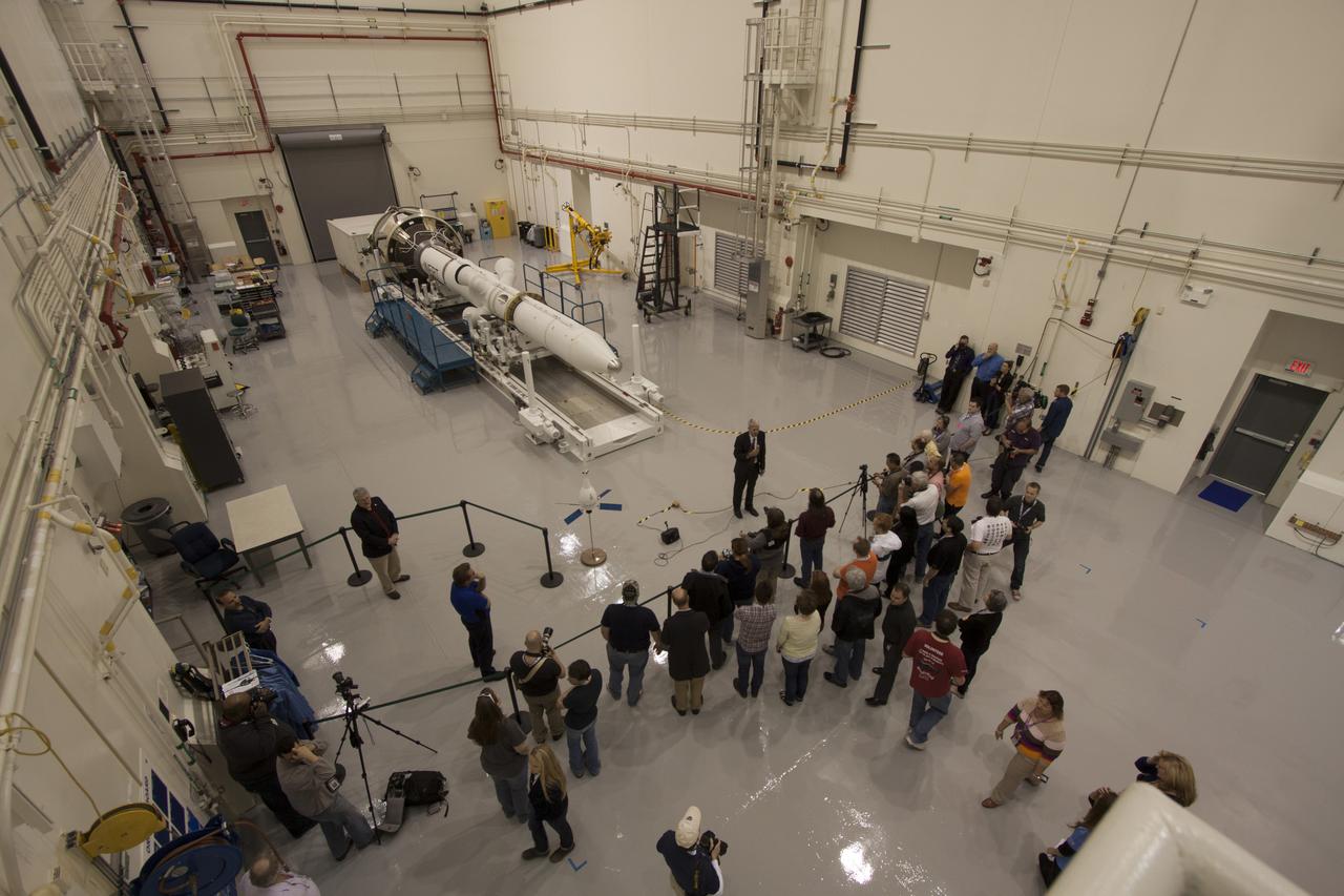 CAPE CANAVERAL, Fla. – A group of news media and social media tweeters toured the Launch Abort System Facility and viewed the launch abort system for the Orion spacecraft at NASA's Kennedy Space Center in Florida. Speaking to the group is Scott Wilson, manager of Production Operations for the Orion Program. The group also toured the Launch Control Center and Vehicle Assembly Building, legacy facilities that are being upgraded by the Ground Systems Development and Operations Program at Kennedy to prepare for processing and launch of NASA's Space Launch System and Orion spacecraft. NASA is developing the Space Launch System and Orion spacecraft to provide an entirely new capability for human exploration beyond low-Earth orbit, with the flexibility to launch spacecraft for crew and cargo missions, including to an asteroid and Mars. Orion’s first unpiloted test flight is scheduled to launch later this year atop a Delta IV rocket. A second uncrewed flight test is scheduled for fiscal year 2018 on the Space Launch System rocket. For more information, visit http://www.nasa.gov/orion. Photo credit: NASA/Cory Huston