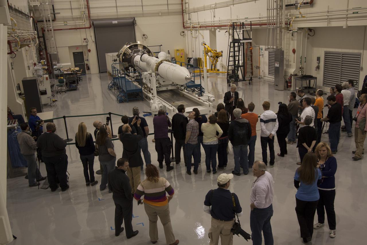 CAPE CANAVERAL, Fla. – A group of news media and social media tweeters toured the Launch Abort System Facility and viewed the launch abort system for the Orion spacecraft at NASA's Kennedy Space Center in Florida. Speaking to the group is Scott Wilson, manager of Production Operations for the Orion Program. The group also toured the Launch Control Center and Vehicle Assembly Building, legacy facilities that are being upgraded by the Ground Systems Development and Operations Program at Kennedy to prepare for processing and launch of NASA's Space Launch System and Orion spacecraft. NASA is developing the Space Launch System and Orion spacecraft to provide an entirely new capability for human exploration beyond low-Earth orbit, with the flexibility to launch spacecraft for crew and cargo missions, including to an asteroid and Mars. Orion’s first unpiloted test flight is scheduled to launch later this year atop a Delta IV rocket. A second uncrewed flight test is scheduled for fiscal year 2018 on the Space Launch System rocket. For more information, visit http://www.nasa.gov/orion. Photo credit: NASA/Cory Huston