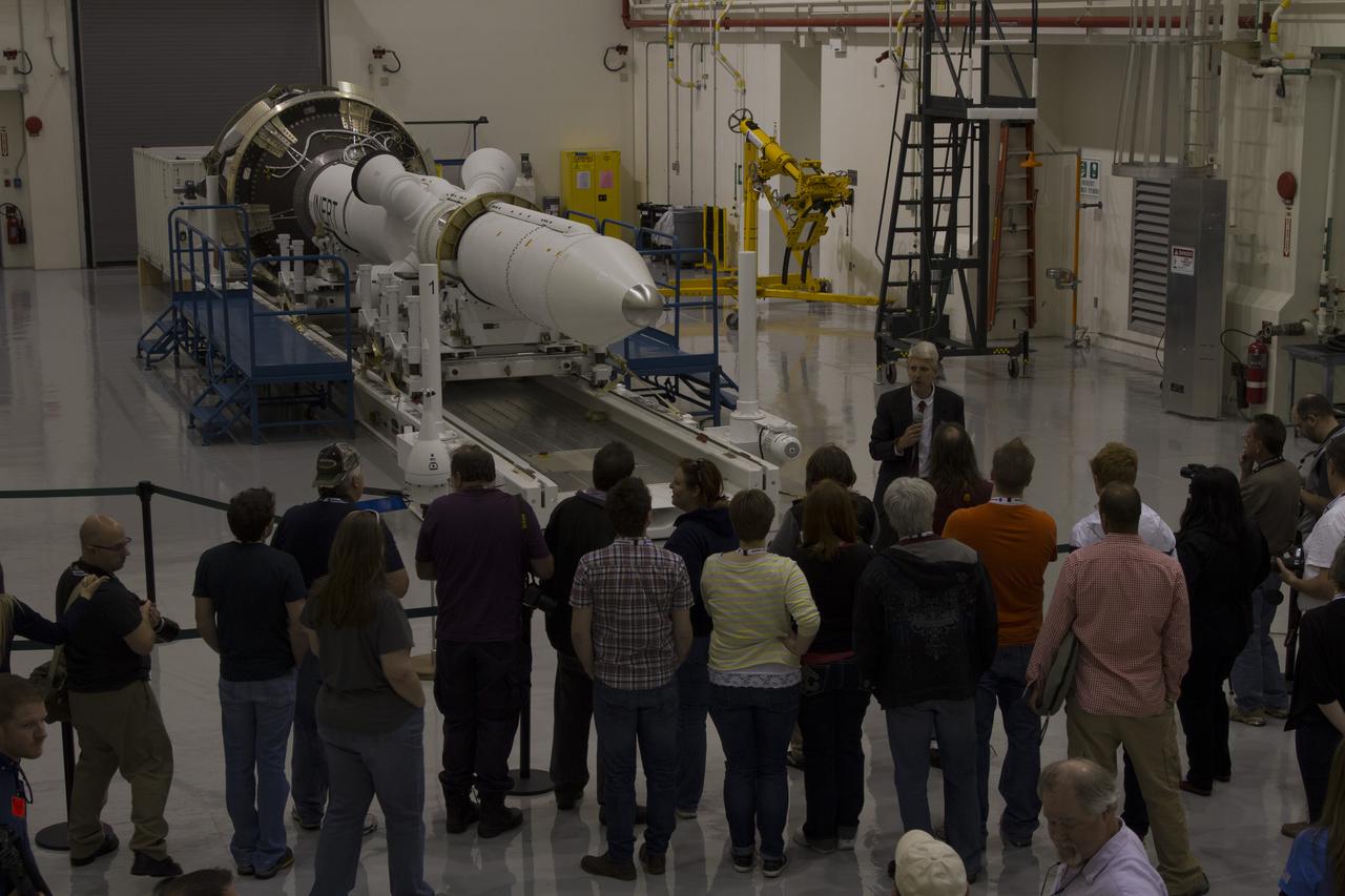 CAPE CANAVERAL, Fla. – A group of news media and social media tweeters toured the Launch Abort System Facility and viewed the launch abort system for the Orion spacecraft at NASA's Kennedy Space Center in Florida. Speaking to the group is Scott Wilson, manager of Production Operations for the Orion Program. The group also toured the Launch Control Center and Vehicle Assembly Building, legacy facilities that are being upgraded by the Ground Systems Development and Operations Program at Kennedy to prepare for processing and launch of NASA's Space Launch System and Orion spacecraft. NASA is developing the Space Launch System and Orion spacecraft to provide an entirely new capability for human exploration beyond low-Earth orbit, with the flexibility to launch spacecraft for crew and cargo missions, including to an asteroid and Mars. Orion’s first unpiloted test flight is scheduled to launch later this year atop a Delta IV rocket. A second uncrewed flight test is scheduled for fiscal year 2018 on the Space Launch System rocket. For more information, visit http://www.nasa.gov/orion. Photo credit: NASA/Cory Huston