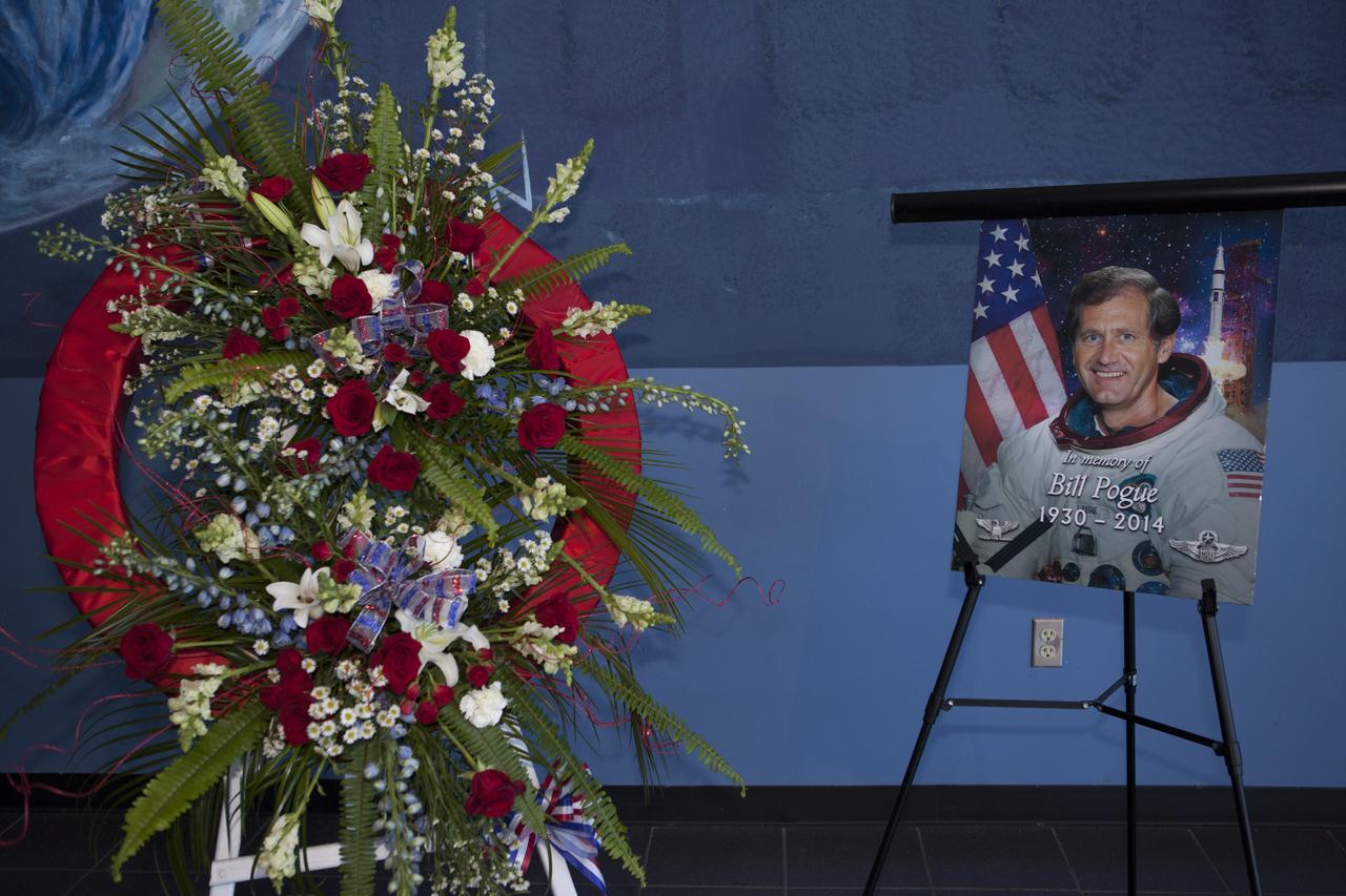 CAPE CANAVERAL, Fla. – A wreath is placed next to a photo of former NASA astronaut William R. Pogue during a ceremony to honor Pogue held at the United States Astronaut Hall of Fame at the Kennedy Space Center Visitor Complex. Col. Pogue, pilot on NASA's Skylab 4 mission in 1973-74, died March 3. He was 84 years old. Skylab 4 was the third and final manned visit to the Skylab orbital workshop, launched Nov. 16, 1973, and concluded Feb. 8, 1974. At 84 days, 1 hour and 15 minutes, Skylab 4 was the longest manned space flight to that date. Pogue was accompanied on the record-setting 34.5-million-mile flight by Commander Gerald P. Carr and science-pilot Dr. Edward G. Gibson. They conducted dozens of experiments and science demonstrations during their 1,214 orbits of Earth. Pogue logged 13 hours and 31 minutes in two spacewalks outside the orbital workshop. For more information, visit http://www.nasa.gov/content/skylab-4-pilot-william-pogue-dies. Photo credit: NASA/Kim Shiflett