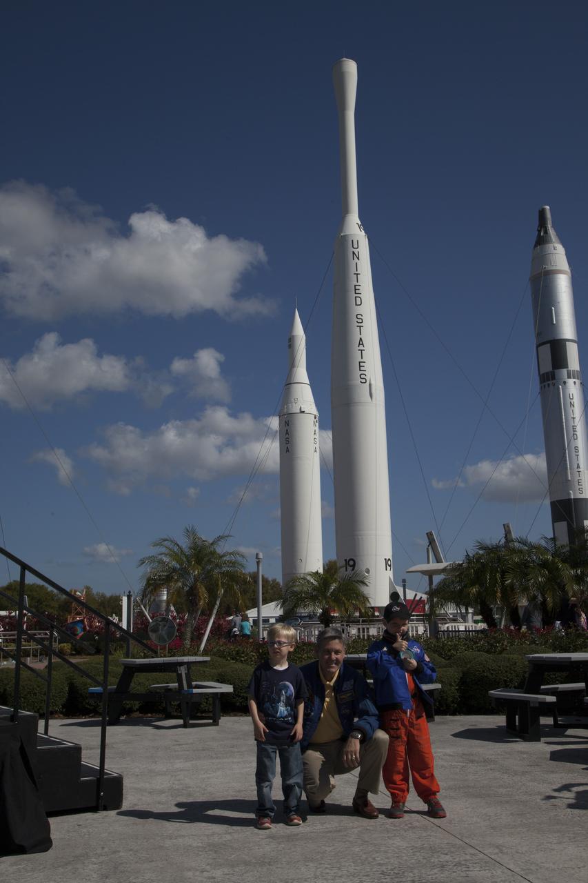 CAPE CANAVERAL, Fla. – Six-year-old Connor Johnson gives a big thumbs up following a ceremony in the Kennedy Space Center Visitor Complex' Rocket Garden during which NASA Kennedy Space Center Director and former astronaut Robert Cabana presented him with space mementos to inspire the youngster to continue the dream he has had since the age of three of becoming an astronaut. From left are Connor's brother Liam, Cabana and Connor. Connor, of Denver, Colo., gained national attention for having the "right stuff" when he launched an online petition on the White House website in December 2013 to save NASA’s funding from budget cuts. One of the mementos, a piece of space history, was a bolt used to hold the International Space Station's Unity module in place in space shuttle Endeavour's payload bay on the STS-88 mission, the first station assembly mission and Cabana's fourth and final spaceflight. Connor and his family were the guests of Delaware North Companies Parks & Resorts, the concessionaire managing the visitor complex. During his visit, Connor had the opportunity to meet with astronauts, see space vehicles and witness the Robot Rocket Rally underway in the complex' Rocket Garden over the weekend. To learn more about the educational activities available daily at the Kennedy Space Center Visitor Complex, visit http://www.kennedyspacecenter.com. Photo credit: NASA/Dan Casper