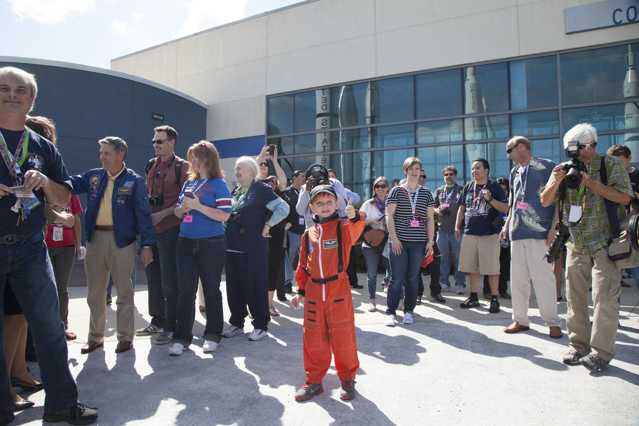 CAPE CANAVERAL, Fla. – Six-year-old Connor Johnson gives a big thumbs up following a ceremony in the Kennedy Space Center Visitor Complex' Rocket Garden during which NASA Kennedy Space Center Director and former astronaut Robert Cabana presented him with space mementos to inspire the youngster to continue the dream he has had since the age of three of becoming an astronaut. Behind Connor is Cabana, second from left, and representatives of news and social media who attended the event. Connor, of Denver, Colo., gained national attention for having the "right stuff" when he launched an online petition on the White House website in December 2013 to save NASA’s funding from budget cuts. One of the mementos, a piece of space history, was a bolt used to hold the International Space Station's Unity module in place in space shuttle Endeavour's payload bay on the STS-88 mission, the first station assembly mission and Cabana's fourth and final spaceflight. Connor and his family were the guests of Delaware North Companies Parks & Resorts, the concessionaire managing the visitor complex. During his visit, Connor had the opportunity to meet with astronauts, see space vehicles and witness the Robot Rocket Rally underway in the complex' Rocket Garden over the weekend. To learn more about the educational activities available daily at the Kennedy Space Center Visitor Complex, visit http://www.kennedyspacecenter.com. Photo credit: NASA/Dan Casper