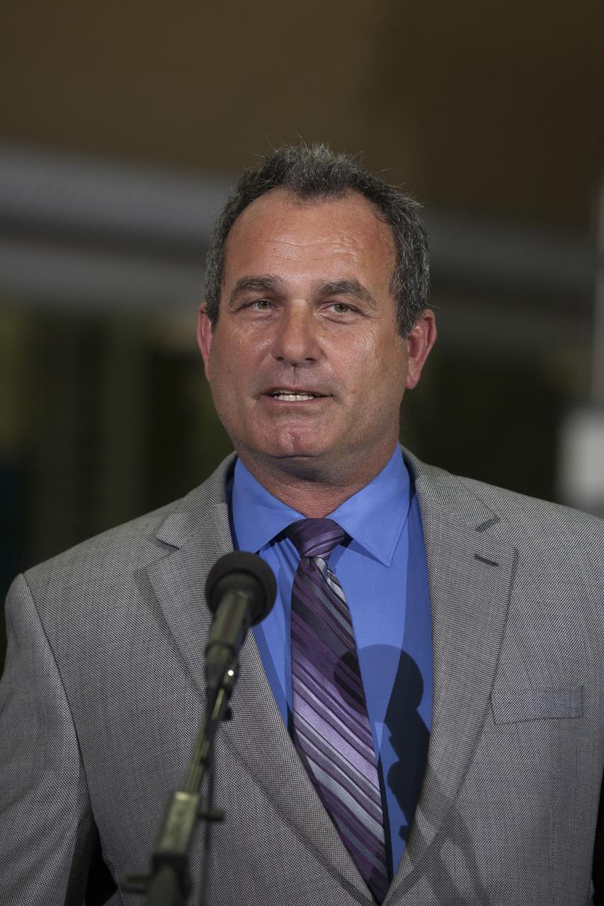 CAPE CANAVERAL, Fla. – During a media event inside the Horizontal Integration Facility at Launch Complex 37 at Cape Canaveral Air Force Station in Florida, Tony Taliancich, director of East Coast Launch Operations with United Launch Alliance, or ULA, speaks to members of the media. Also with him at the briefing were Kennedy Space Center Director Bob Cabana and NASA Associate Administrator Robert Lightfoot. The event was held to showcase two of the ULA Delta IV boosters for the Orion Exploration Flight Test-1, or EFT-1, mission. Orion is the exploration spacecraft designed to carry astronauts to destinations not yet explored by humans, including an asteroid and Mars. It will have emergency abort capability, sustain the crew during space travel and provide safe re-entry from deep space return velocities. The first unpiloted test flight of Orion, EFT-1, is scheduled to launch in 2014 atop a Delta IV rocket and in 2017 on NASA’s Space Launch System rocket. For more information, visit http://www.nasa.gov/orion. Photo credit: NASA/Kim Shiflett