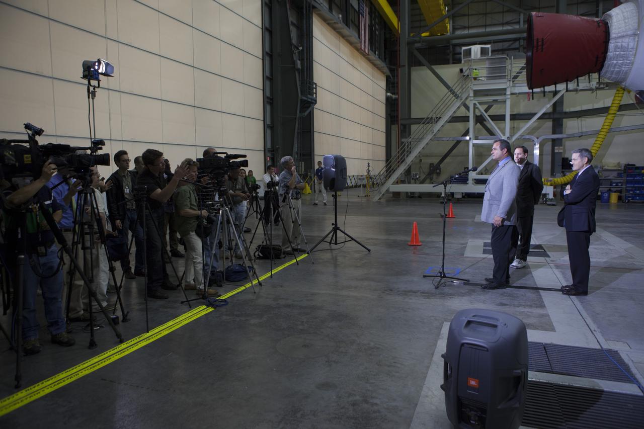 CAPE CANAVERAL, Fla. – During a media event inside the Horizontal Integration Facility at Launch Complex 37 at Cape Canaveral Air Force Station in Florida, Tony Taliancich, director of East Coast Launch Operations with United Launch Alliance, or ULA, speaks to members of the media. Also with Taliancich at the briefing were Kennedy Space Center Director Bob Cabana, at right, and NASA Associate Administrator Robert Lightfoot. The event was held to showcase two of the ULA Delta IV boosters for the Orion Exploration Flight Test-1, or EFT-1, mission. Orion is the exploration spacecraft designed to carry astronauts to destinations not yet explored by humans, including an asteroid and Mars. It will have emergency abort capability, sustain the crew during space travel and provide safe re-entry from deep space return velocities. The first unpiloted test flight of Orion, EFT-1, is scheduled to launch in 2014 atop a Delta IV rocket and in 2017 on NASA’s Space Launch System rocket. For more information, visit http://www.nasa.gov/orion. Photo credit: NASA/Kim Shiflett