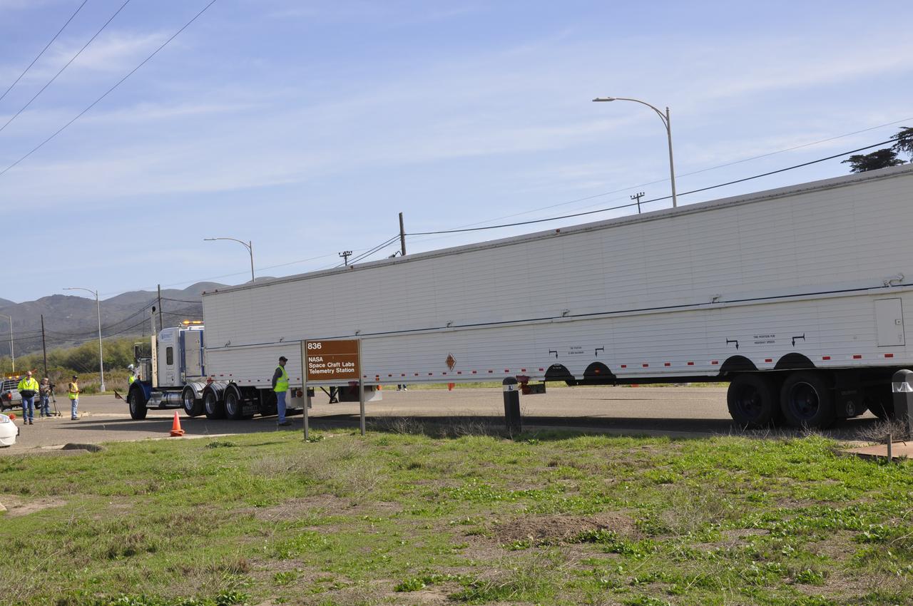 VANDENBERG AIR FORCE BASE, Calif. – The truck transporting the Delta first-stage booster for NASA's Orbiting Carbon Observatory-2 mission, or OCO-2, arrives outside the Building 836 hangar at Space Launch Complex 2 on Vandenberg Air Force Base in California. OCO-2 is scheduled to launch aboard a United Launch Alliance Delta II rocket in July. The observatory will collect precise global measurements of carbon dioxide in the Earth's atmosphere and provide scientists with a better idea of the chemical compound's impacts on climate change. Scientists will analyze this data to improve our understanding of the natural processes and human activities that regulate the abundance and distribution of this important atmospheric gas. To learn more about OCO-2, visit http://oco.jpl.nasa.gov. Photo credit: NASA/Randy Beaudoin