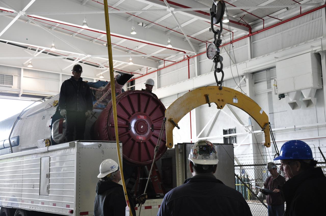 VANDENBERG AIR FORCE BASE, Calif. – Workers prepare to lift the Delta first-stage booster for NASA's Orbiting Carbon Observatory-2 mission, or OCO-2, from its transportation trailer in the Building 836 hangar at Space Launch Complex 2 on Vandenberg Air Force Base in California. OCO-2 is scheduled to launch aboard a United Launch Alliance Delta II rocket in July. The observatory will collect precise global measurements of carbon dioxide in the Earth's atmosphere and provide scientists with a better idea of the chemical compound's impacts on climate change. Scientists will analyze this data to improve our understanding of the natural processes and human activities that regulate the abundance and distribution of this important atmospheric gas. To learn more about OCO-2, visit http://oco.jpl.nasa.gov. Photo credit: NASA/Randy Beaudoin