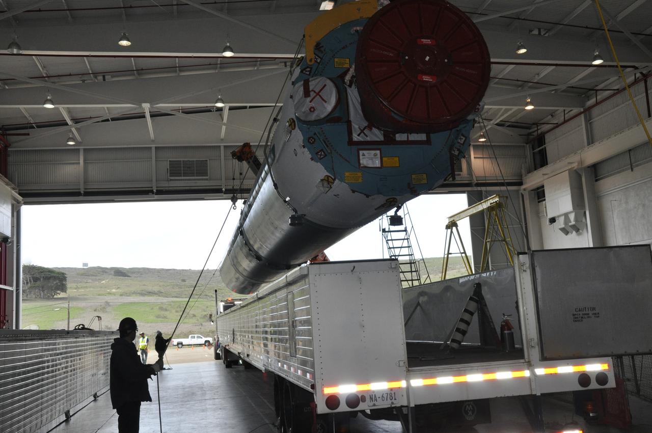 VANDENBERG AIR FORCE BASE, Calif. – Workers steady the Delta first-stage booster for NASA's Orbiting Carbon Observatory-2 mission, or OCO-2, as it is lifted from its transportation trailer in the Building 836 hangar at Space Launch Complex 2 on Vandenberg Air Force Base in California. OCO-2 is scheduled to launch aboard a United Launch Alliance Delta II rocket in July. The observatory will collect precise global measurements of carbon dioxide in the Earth's atmosphere and provide scientists with a better idea of the chemical compound's impacts on climate change. Scientists will analyze this data to improve our understanding of the natural processes and human activities that regulate the abundance and distribution of this important atmospheric gas. To learn more about OCO-2, visit http://oco.jpl.nasa.gov. Photo credit: NASA/Randy Beaudoin