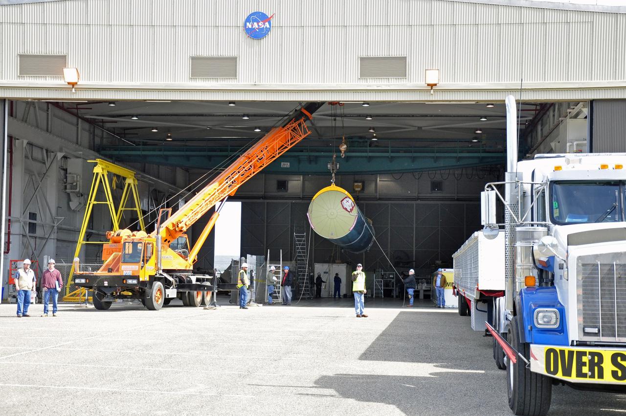 VANDENBERG AIR FORCE BASE, Calif. – The Delta first-stage booster for NASA's Orbiting Carbon Observatory-2 mission, or OCO-2, is suspended midair during its transfer from its transportation trailer to a transportation hardware cradle in the Building 836 hangar at Space Launch Complex 2 on Vandenberg Air Force Base in California. OCO-2 is scheduled to launch aboard a United Launch Alliance Delta II rocket in July. The observatory will collect precise global measurements of carbon dioxide in the Earth's atmosphere and provide scientists with a better idea of the chemical compound's impacts on climate change. Scientists will analyze this data to improve our understanding of the natural processes and human activities that regulate the abundance and distribution of this important atmospheric gas. To learn more about OCO-2, visit http://oco.jpl.nasa.gov. Photo credit: NASA/Randy Beaudoin