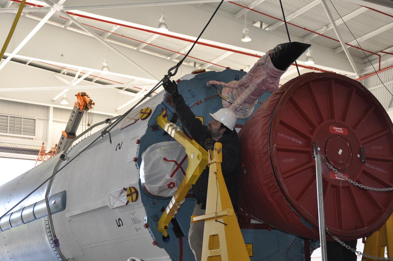 VANDENBERG AIR FORCE BASE, Calif. – The Delta first-stage booster for NASA's Orbiting Carbon Observatory-2 mission, or OCO-2, is lowered onto a transportation hardware cradle in the Building 836 hangar at Space Launch Complex 2 on Vandenberg Air Force Base in California. OCO-2 is scheduled to launch aboard a United Launch Alliance Delta II rocket in July. The observatory will collect precise global measurements of carbon dioxide in the Earth's atmosphere and provide scientists with a better idea of the chemical compound's impacts on climate change. Scientists will analyze this data to improve our understanding of the natural processes and human activities that regulate the abundance and distribution of this important atmospheric gas. To learn more about OCO-2, visit http://oco.jpl.nasa.gov. Photo credit: NASA/Randy Beaudoin