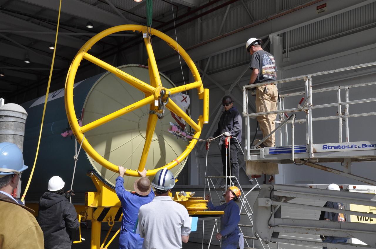 VANDENBERG AIR FORCE BASE, Calif. – Workers secure the Delta first-stage booster for NASA's Orbiting Carbon Observatory-2 mission, or OCO-2, onto a transportation hardware cradle in the Building 836 hangar at Space Launch Complex 2 on Vandenberg Air Force Base in California. OCO-2 is scheduled to launch aboard a United Launch Alliance Delta II rocket in July. The observatory will collect precise global measurements of carbon dioxide in the Earth's atmosphere and provide scientists with a better idea of the chemical compound's impacts on climate change. Scientists will analyze this data to improve our understanding of the natural processes and human activities that regulate the abundance and distribution of this important atmospheric gas. To learn more about OCO-2, visit http://oco.jpl.nasa.gov. Photo credit: NASA/Randy Beaudoin