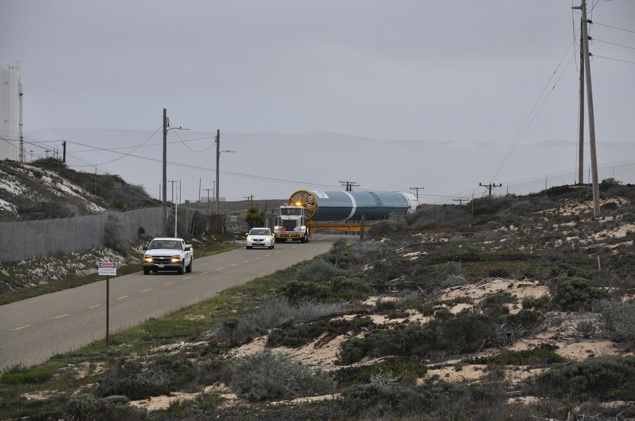 VANDENBERG AIR FORCE BASE, Calif. – The Delta first-stage booster for NASA's Orbiting Carbon Observatory-2 mission, or OCO-2, is towed to the Horizontal Processing Facility at Space Launch Complex 2 on Vandenberg Air Force Base in California. OCO-2 is scheduled to launch aboard a United Launch Alliance Delta II rocket in July. The observatory will collect precise global measurements of carbon dioxide in the Earth's atmosphere and provide scientists with a better idea of the chemical compound's impacts on climate change. Scientists will analyze this data to improve our understanding of the natural processes and human activities that regulate the abundance and distribution of this important atmospheric gas. To learn more about OCO-2, visit http://oco.jpl.nasa.gov. Photo credit: NASA/Randy Beaudoin