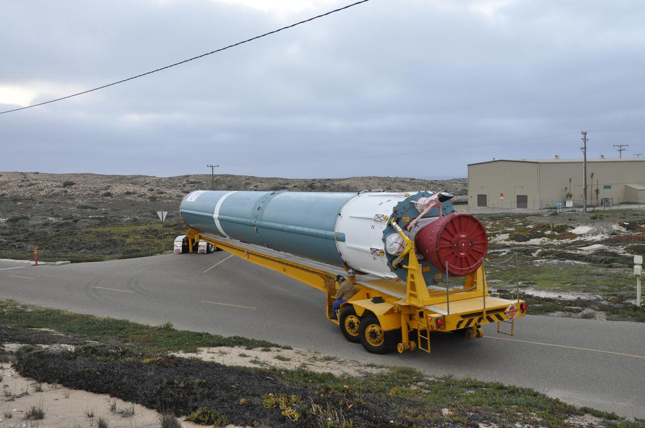 VANDENBERG AIR FORCE BASE, Calif. – The Delta first-stage booster for NASA's Orbiting Carbon Observatory-2 mission, or OCO-2, arrives at the Horizontal Processing Facility at Space Launch Complex 2 on Vandenberg Air Force Base in California. OCO-2 is scheduled to launch aboard a United Launch Alliance Delta II rocket in July. The observatory will collect precise global measurements of carbon dioxide in the Earth's atmosphere and provide scientists with a better idea of the chemical compound's impacts on climate change. Scientists will analyze this data to improve our understanding of the natural processes and human activities that regulate the abundance and distribution of this important atmospheric gas. To learn more about OCO-2, visit http://oco.jpl.nasa.gov. Photo credit: NASA/Randy Beaudoin