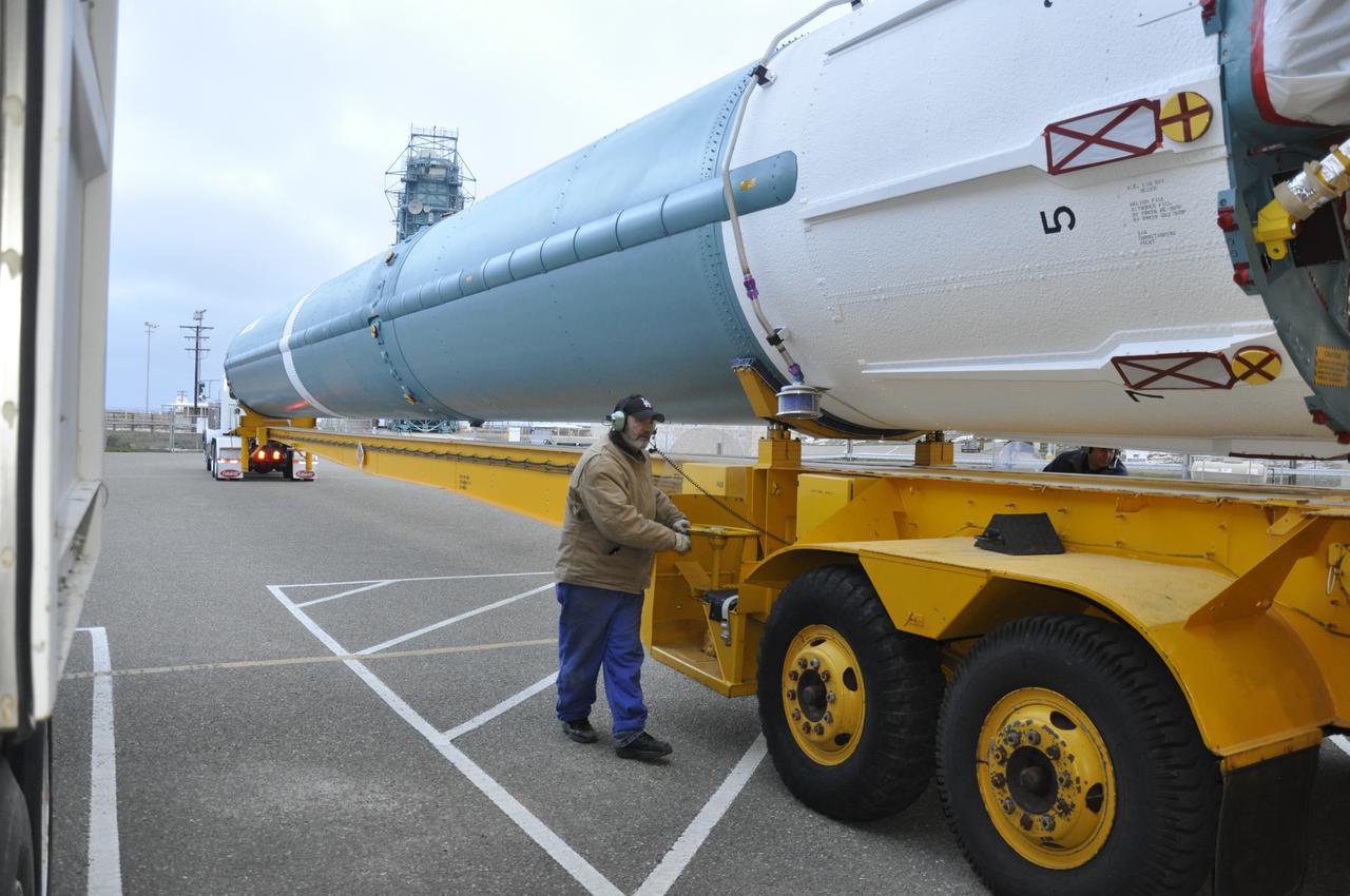 VANDENBERG AIR FORCE BASE, Calif. – A worker surveys the Delta first-stage booster for NASA's Orbiting Carbon Observatory-2 mission, or OCO-2, secured in a transportation hardware cradle, that he delivered to the Horizontal Processing Facility at Space Launch Complex 2 on Vandenberg Air Force Base in California. OCO-2 is scheduled to launch aboard a United Launch Alliance Delta II rocket in July. The observatory will collect precise global measurements of carbon dioxide in the Earth's atmosphere and provide scientists with a better idea of the chemical compound's impacts on climate change. Scientists will analyze this data to improve our understanding of the natural processes and human activities that regulate the abundance and distribution of this important atmospheric gas. To learn more about OCO-2, visit http://oco.jpl.nasa.gov. Photo credit: NASA/Randy Beaudoin