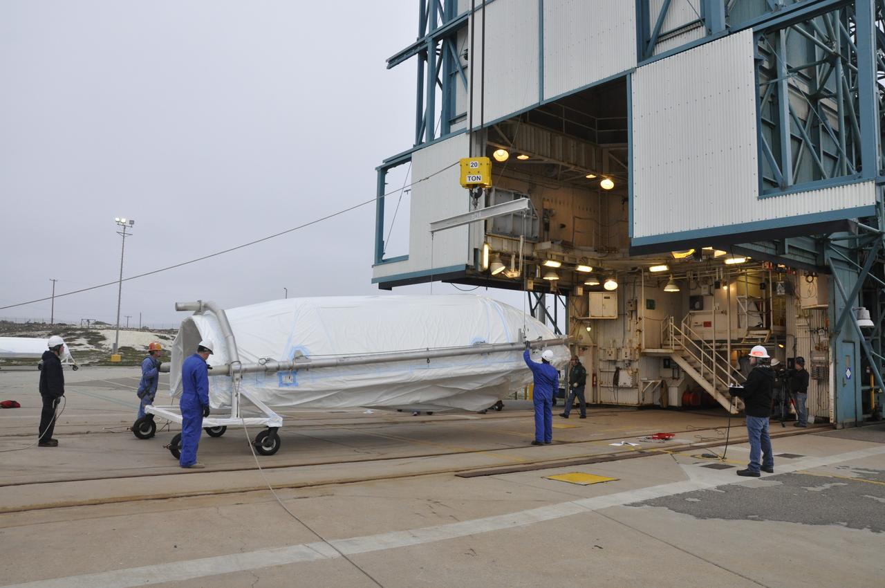 VANDENBERG AIR FORCE BASE, Calif. – Preparations are underway to lift half of the fairing for NASA's Orbiting Carbon Observatory-2 mission, or OCO-2, into a vertical position at Space Launch Complex 2 on Vandenberg Air Force Base in California. Operations are underway to hoist this section of the fairing into the Delta II launcher's environmental enclosure, or clean room, at the top of the tower. The fairing will protect OCO-2 during launch aboard a United Launch Alliance Delta II rocket from Space Launch Complex 2 in July. The observatory will collect precise global measurements of carbon dioxide in the Earth's atmosphere and provide scientists with a better idea of the chemical compound's impacts on climate change. Scientists will analyze this data to improve our understanding of the natural processes and human activities that regulate the abundance and distribution of this important atmospheric gas. To learn more about OCO-2, visit http://oco.jpl.nasa.gov. Photo credit: NASA/Randy Beaudoin