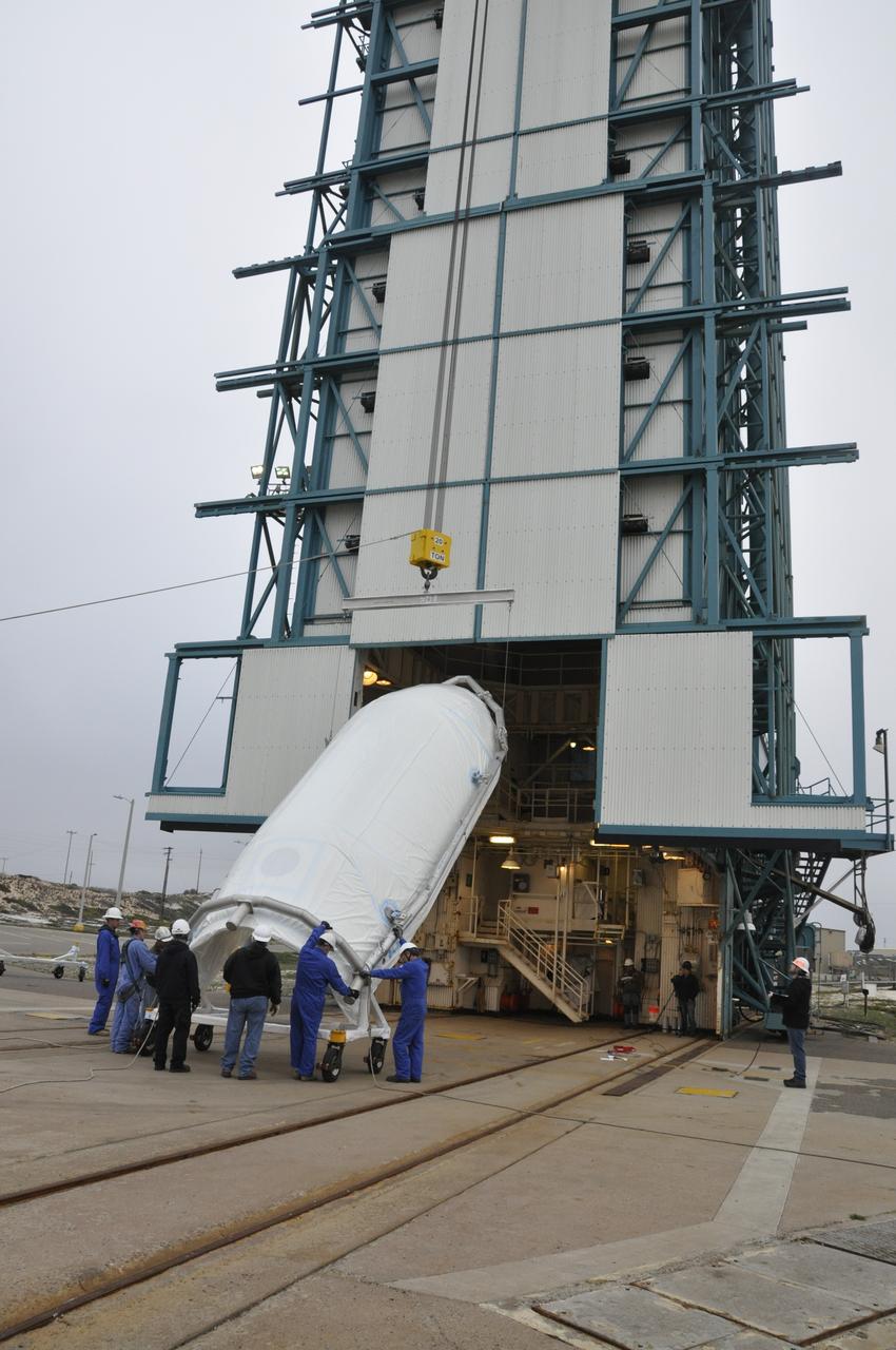 VANDENBERG AIR FORCE BASE, Calif. – Half of the fairing for NASA's Orbiting Carbon Observatory-2 mission, or OCO-2, is lifted into a vertical position at Space Launch Complex 2 on Vandenberg Air Force Base in California. Operations are underway to hoist this section of the fairing into the Delta II launcher's environmental enclosure, or clean room, at the top of the tower. The fairing will protect OCO-2 during launch aboard a United Launch Alliance Delta II rocket from Space Launch Complex 2 in July. The observatory will collect precise global measurements of carbon dioxide in the Earth's atmosphere and provide scientists with a better idea of the chemical compound's impacts on climate change. Scientists will analyze this data to improve our understanding of the natural processes and human activities that regulate the abundance and distribution of this important atmospheric gas. To learn more about OCO-2, visit http://oco.jpl.nasa.gov. Photo credit: NASA/Randy Beaudoin