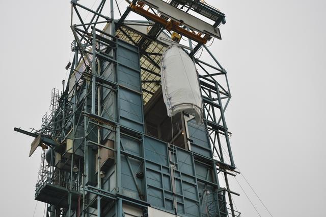 NASA image: OCO-2: Hoisting the Fairing Halves up the MST