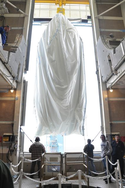 NASA image: OCO-2: Hoisting the Fairing Halves up the MST