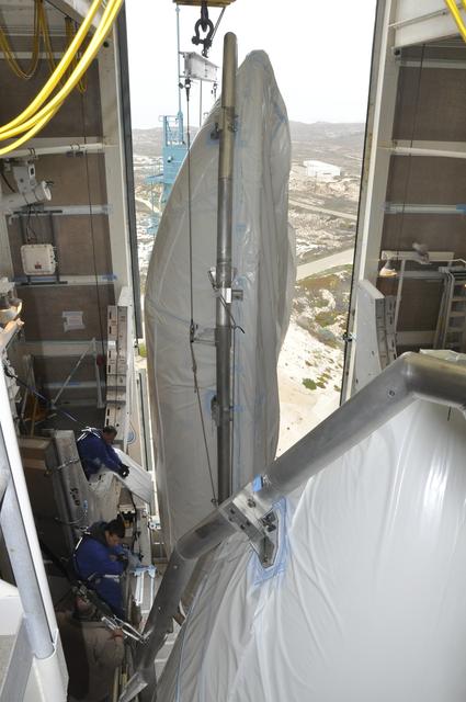 NASA image: OCO-2: Hoisting the Fairing Halves up the MST
