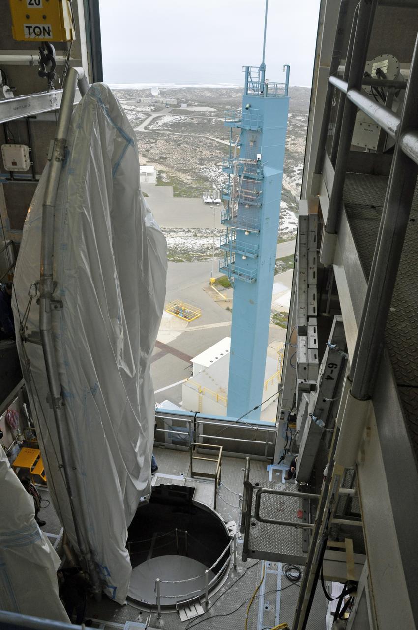 VANDENBERG AIR FORCE BASE, Calif. – Both halves of the fairing for NASA's Orbiting Carbon Observatory-2 mission, or OCO-2, have arrived in the environmental enclosure, or clean room, at the top of the Delta II launcher at Space Launch Complex 2 on Vandenberg Air Force Base in California. The fairing will protect OCO-2 during launch aboard a United Launch Alliance Delta II rocket from Space Launch Complex 2 in July. The observatory will collect precise global measurements of carbon dioxide in the Earth's atmosphere and provide scientists with a better idea of the chemical compound's impacts on climate change. Scientists will analyze this data to improve our understanding of the natural processes and human activities that regulate the abundance and distribution of this important atmospheric gas. To learn more about OCO-2, visit http://oco.jpl.nasa.gov. Photo credit: NASA/Randy Beaudoin