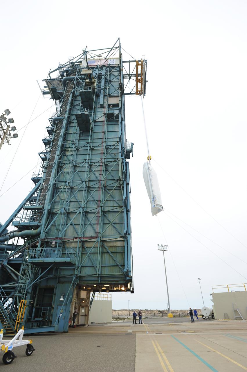 VANDENBERG AIR FORCE BASE, Calif. – Half of the fairing for NASA's Orbiting Carbon Observatory-2 mission, or OCO-2, is lifted up the side of the mobile service tower at Space Launch Complex 2 on Vandenberg Air Force Base in California toward the Delta II launcher's environmental enclosure, or clean room, at the top of the tower. The fairing will protect OCO-2 during launch aboard a United Launch Alliance Delta II rocket from Space Launch Complex 2 in July. The observatory will collect precise global measurements of carbon dioxide in the Earth's atmosphere and provide scientists with a better idea of the chemical compound's impacts on climate change. Scientists will analyze this data to improve our understanding of the natural processes and human activities that regulate the abundance and distribution of this important atmospheric gas. To learn more about OCO-2, visit http://oco.jpl.nasa.gov. Photo credit: NASA/30th Space Wing, VAFB