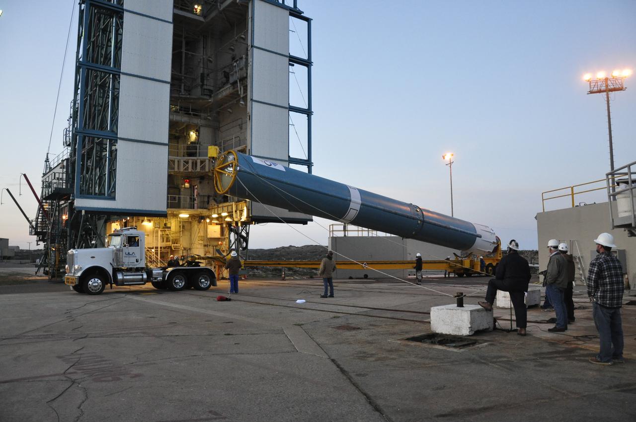 VANDENBERG AIR FORCE BASE, Calif. – The United Launch Alliance Delta II rocket for NASA's Orbiting Carbon Observatory-2 mission, or OCO-2, is lifted into a vertical position beside the mobile service tower at Space Launch Complex 2 on Vandenberg Air Force Base in California. Launch is scheduled for July 2014. The observatory will collect precise global measurements of carbon dioxide in the Earth's atmosphere and provide scientists with a better idea of the chemical compound's impacts on climate change. Scientists will analyze this data to improve our understanding of the natural processes and human activities that regulate the abundance and distribution of this important atmospheric gas. To learn more about OCO-2, visit http://oco.jpl.nasa.gov. Photo credit: NASA/Randy Beaudoin
