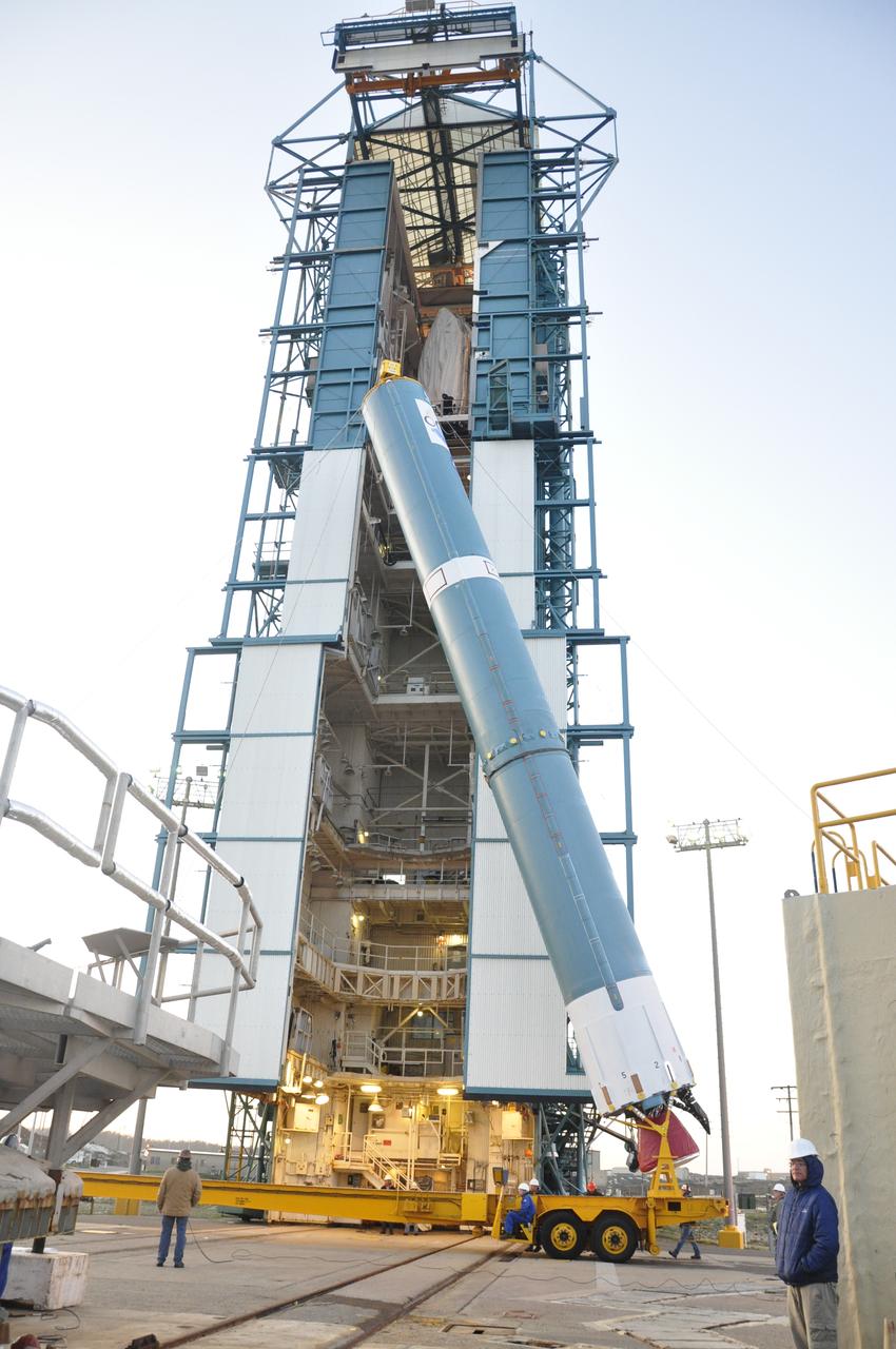 VANDENBERG AIR FORCE BASE, Calif. – The United Launch Alliance Delta II rocket for NASA's Orbiting Carbon Observatory-2 mission, or OCO-2, is lifted into a vertical position beside the mobile service tower at Space Launch Complex 2 on Vandenberg Air Force Base in California. Launch is scheduled for July 2014. The observatory will collect precise global measurements of carbon dioxide in the Earth's atmosphere and provide scientists with a better idea of the chemical compound's impacts on climate change. Scientists will analyze this data to improve our understanding of the natural processes and human activities that regulate the abundance and distribution of this important atmospheric gas. To learn more about OCO-2, visit http://oco.jpl.nasa.gov. Photo credit: NASA/Randy Beaudoin