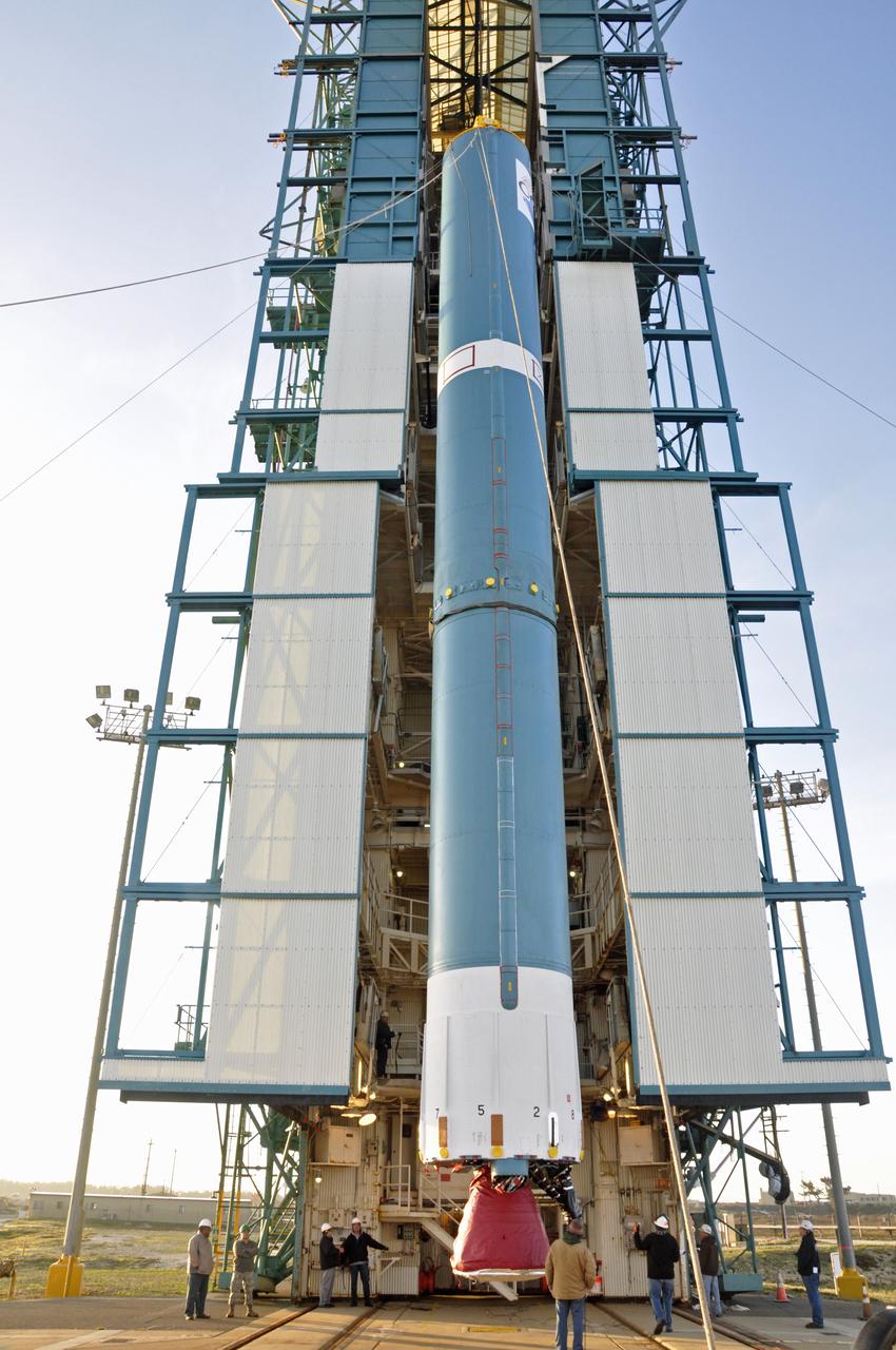 VANDENBERG AIR FORCE BASE, Calif. – The United Launch Alliance Delta II rocket for NASA's Orbiting Carbon Observatory-2 mission, or OCO-2, is lifted into the mobile service tower at Space Launch Complex 2 on Vandenberg Air Force Base in California. Launch is scheduled for July 2014. The observatory will collect precise global measurements of carbon dioxide in the Earth's atmosphere and provide scientists with a better idea of the chemical compound's impacts on climate change. Scientists will analyze this data to improve our understanding of the natural processes and human activities that regulate the abundance and distribution of this important atmospheric gas. To learn more about OCO-2, visit http://oco.jpl.nasa.gov. Photo credit: NASA/Randy Beaudoin
