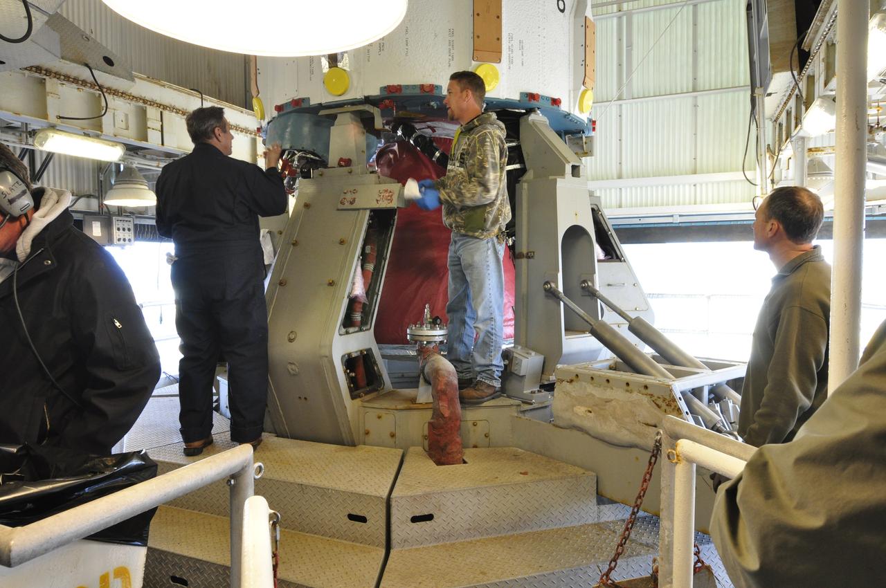 VANDENBERG AIR FORCE BASE, Calif. – Workers secure the United Launch Alliance Delta II rocket for NASA's Orbiting Carbon Observatory-2 mission, or OCO-2, onto a launch stand in the mobile service tower at Space Launch Complex 2 on Vandenberg Air Force Base in California. Launch is scheduled for July 2014. The observatory will collect precise global measurements of carbon dioxide in the Earth's atmosphere and provide scientists with a better idea of the chemical compound's impacts on climate change. Scientists will analyze this data to improve our understanding of the natural processes and human activities that regulate the abundance and distribution of this important atmospheric gas. To learn more about OCO-2, visit http://oco.jpl.nasa.gov. Photo credit: NASA/Randy Beaudoin