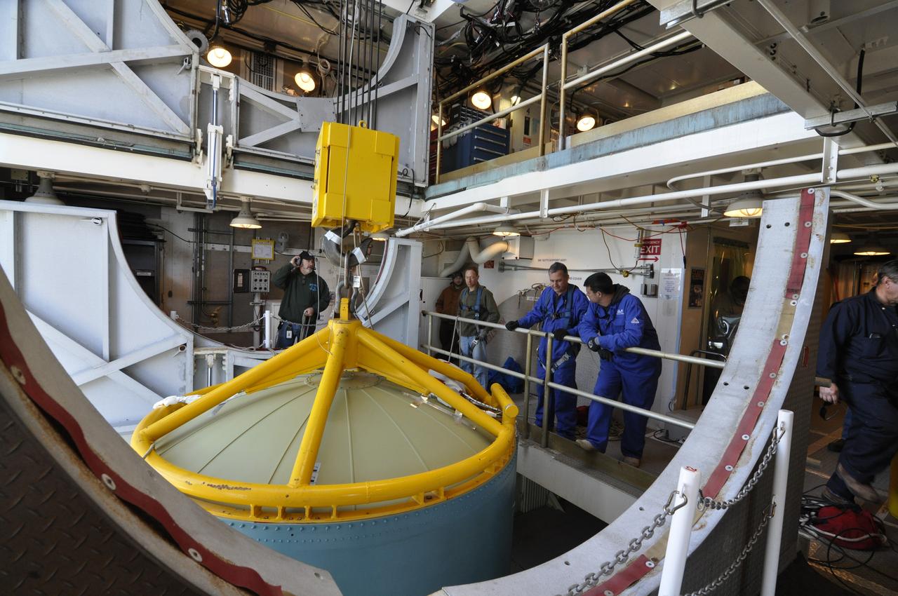 VANDENBERG AIR FORCE BASE, Calif. – Workers in the environmental enclosure, or clean room, at the top of the mobile service tower at Space Launch Complex 2 on Vandenberg Air Force Base in California prepare to release the upper end of the United Launch Alliance Delta II rocket for NASA's Orbiting Carbon Observatory-2 mission, or OCO-2, from the lifting device. Launch is scheduled for July 2014. The observatory will collect precise global measurements of carbon dioxide in the Earth's atmosphere and provide scientists with a better idea of the chemical compound's impacts on climate change. Scientists will analyze this data to improve our understanding of the natural processes and human activities that regulate the abundance and distribution of this important atmospheric gas. To learn more about OCO-2, visit http://oco.jpl.nasa.gov. Photo credit: NASA/Randy Beaudoin
