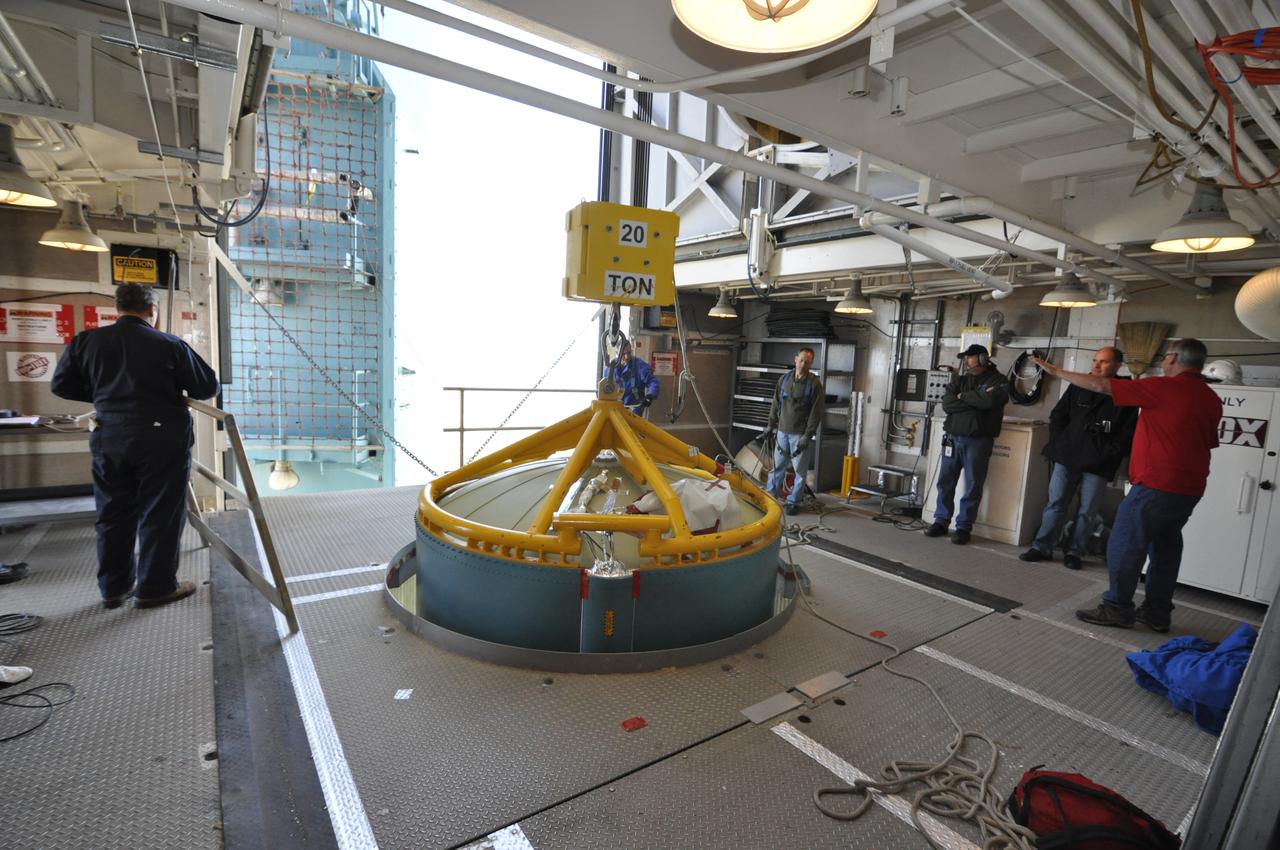 VANDENBERG AIR FORCE BASE, Calif. – Work platforms are moved into place around the upper end of the United Launch Alliance Delta II rocket for NASA's Orbiting Carbon Observatory-2 mission, or OCO-2, in the environmental enclosure, or clean room, at the top of the mobile service tower at Space Launch Complex 2 on Vandenberg Air Force Base in California. Launch is scheduled for July 2014. The observatory will collect precise global measurements of carbon dioxide in the Earth's atmosphere and provide scientists with a better idea of the chemical compound's impacts on climate change. Scientists will analyze this data to improve our understanding of the natural processes and human activities that regulate the abundance and distribution of this important atmospheric gas. To learn more about OCO-2, visit http://oco.jpl.nasa.gov. Photo credit: NASA/Randy Beaudoin