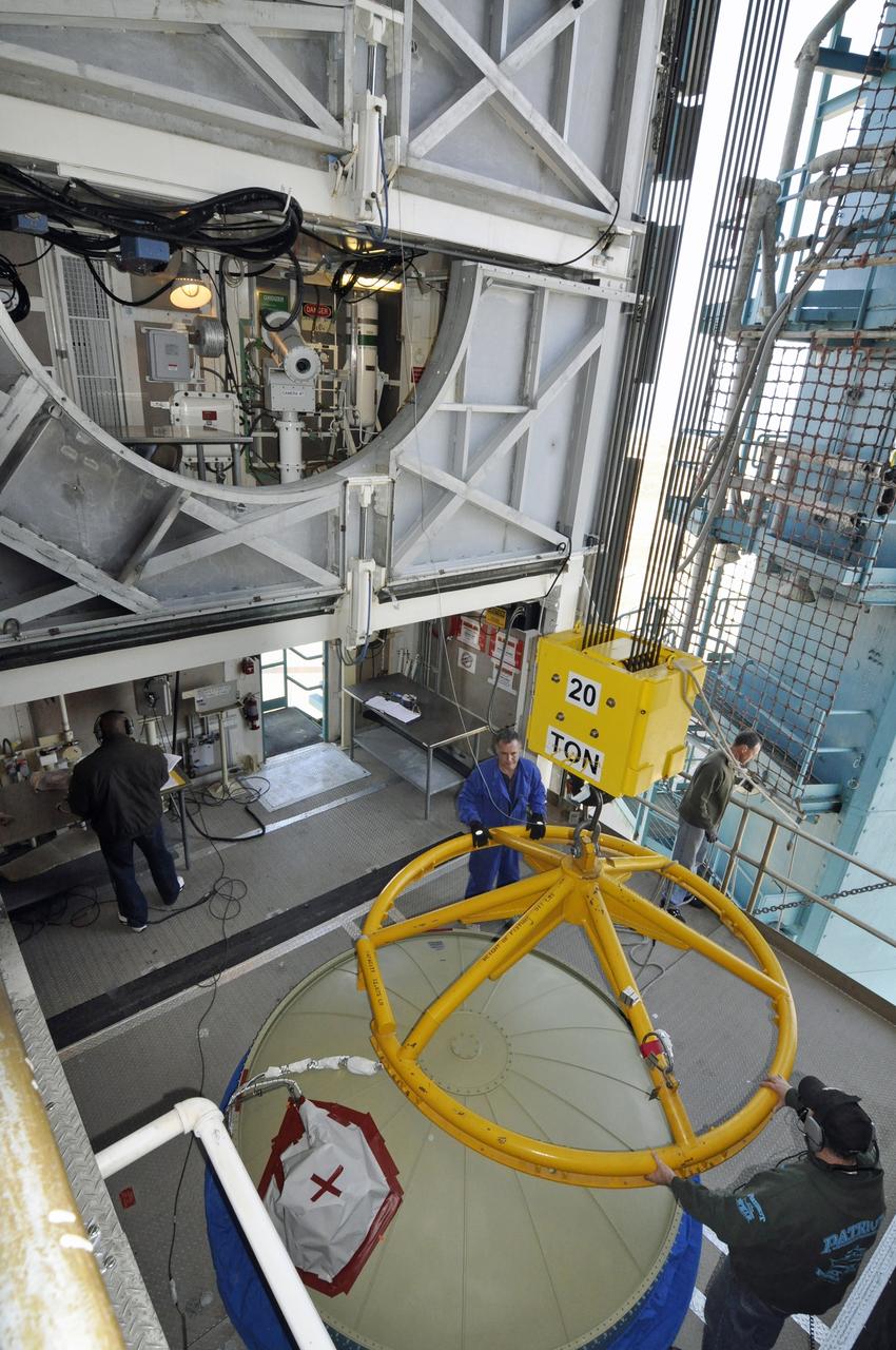 VANDENBERG AIR FORCE BASE, Calif. – The lifting device detached and moved away from the upper end of the United Launch Alliance Delta II rocket for NASA's Orbiting Carbon Observatory-2 mission, or OCO-2, in the environmental enclosure, or clean room, at the top of the mobile service tower at Space Launch Complex 2 on Vandenberg Air Force Base in California. Launch is scheduled for July 2014. The observatory will collect precise global measurements of carbon dioxide in the Earth's atmosphere and provide scientists with a better idea of the chemical compound's impacts on climate change. Scientists will analyze this data to improve our understanding of the natural processes and human activities that regulate the abundance and distribution of this important atmospheric gas. To learn more about OCO-2, visit http://oco.jpl.nasa.gov. Photo credit: NASA/Randy Beaudoin